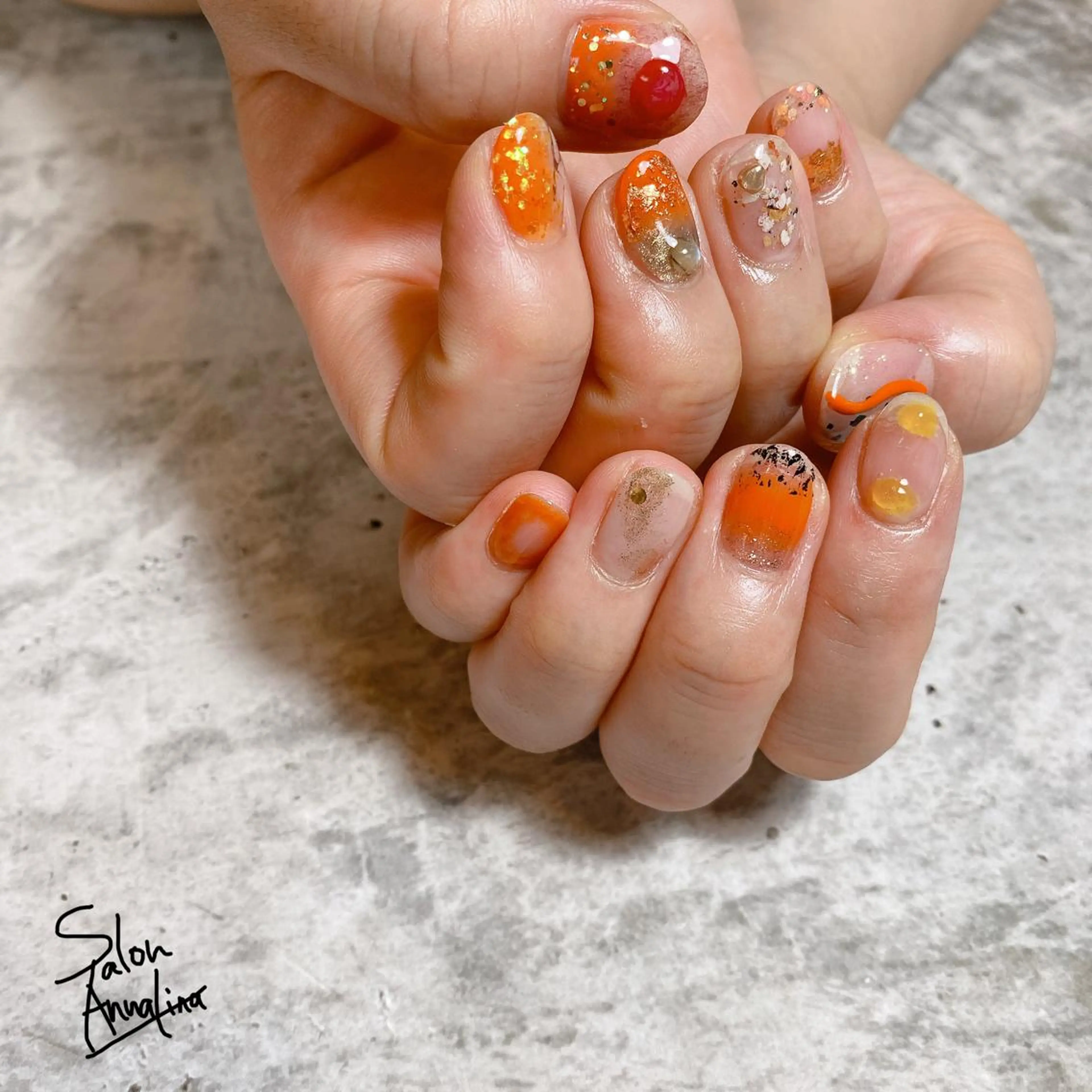 ネイル オレンジ アトリエ UNICOのネイルデザイン