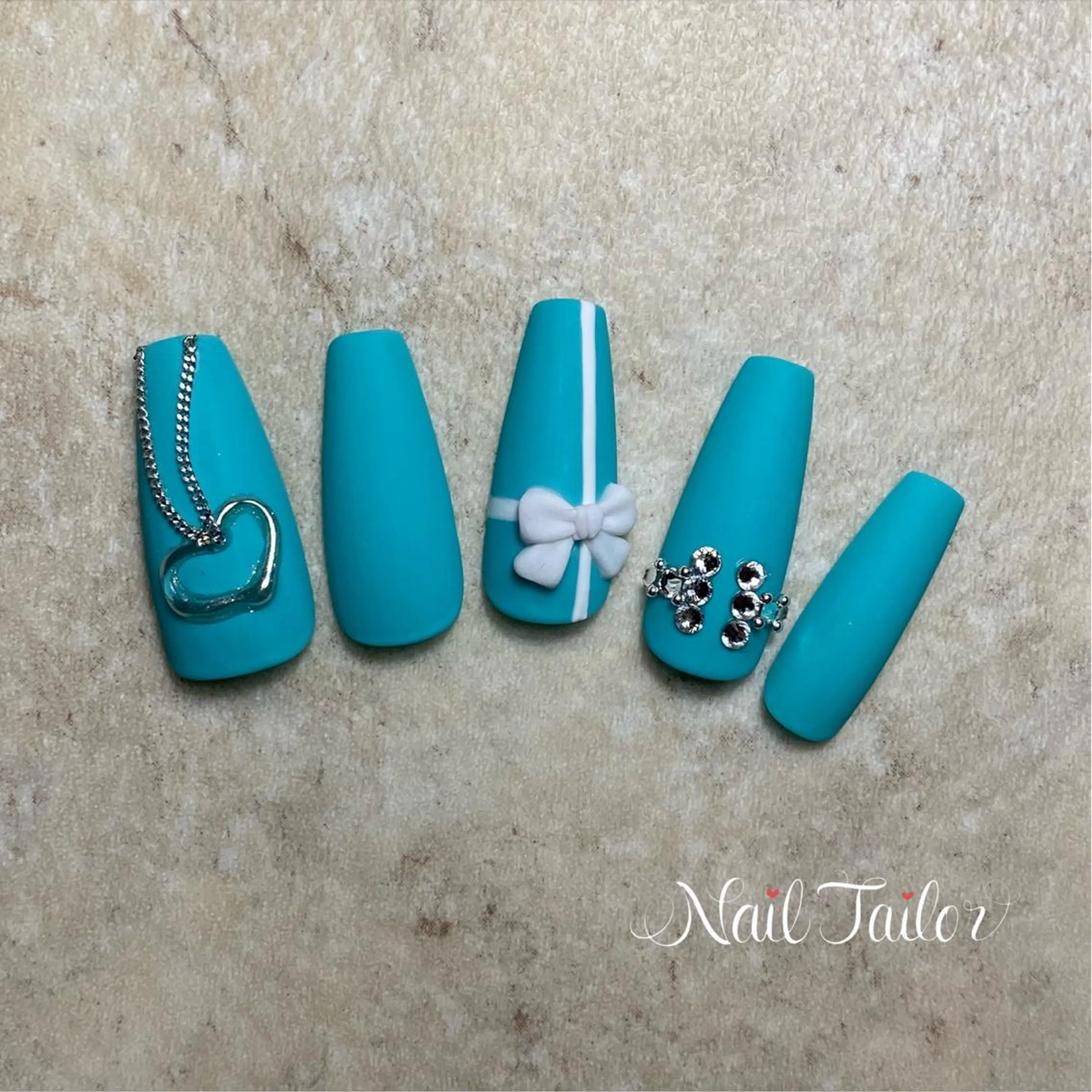 ネイル 長さ出し ワンカラーネイル リボン 春ネイル 〜Nail Tailor〜　ネイルテイラー所属・NailTailor ネイルテイラーのネイルデザイン