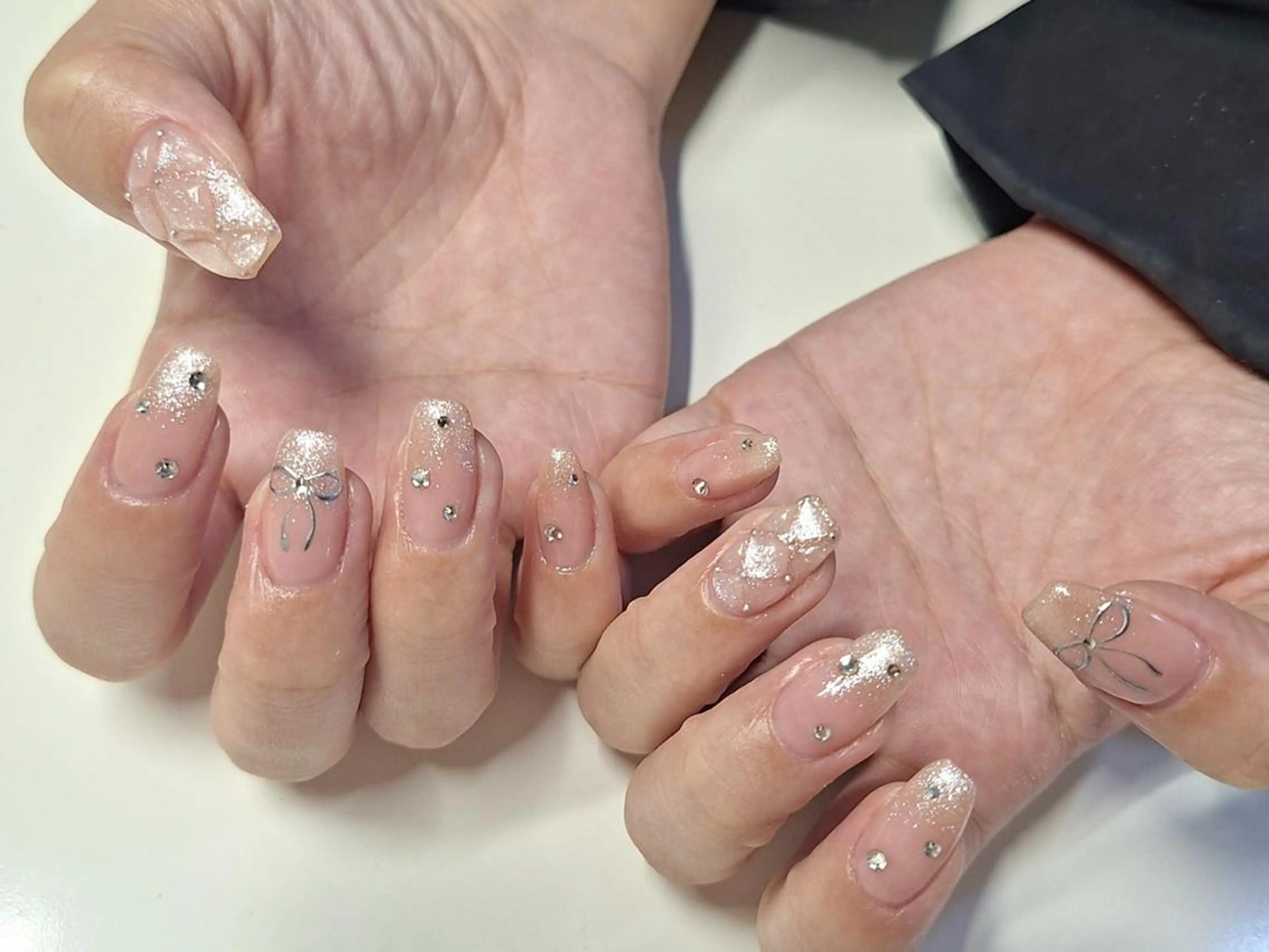 ネイル ジェルネイル 韓国ネイル ニュアンスネイル リボン ワンホンネイル nailstudio eviz新宿店のネイルデザイン