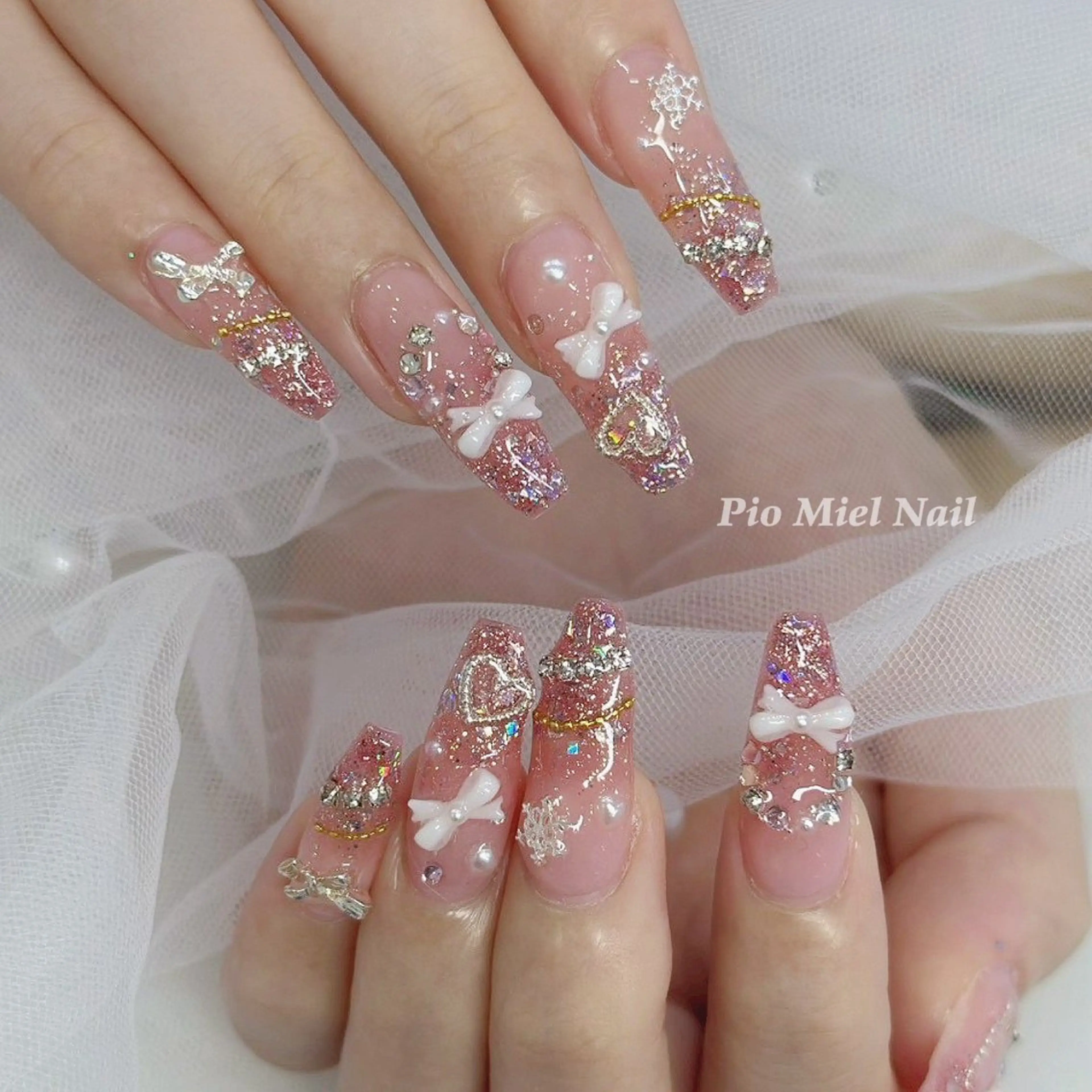 ネイル グラデーション ラメ(グリッター) ラメグラデーション ピンク リボン ハンドネイル momo 長さだしのネイルデザイン