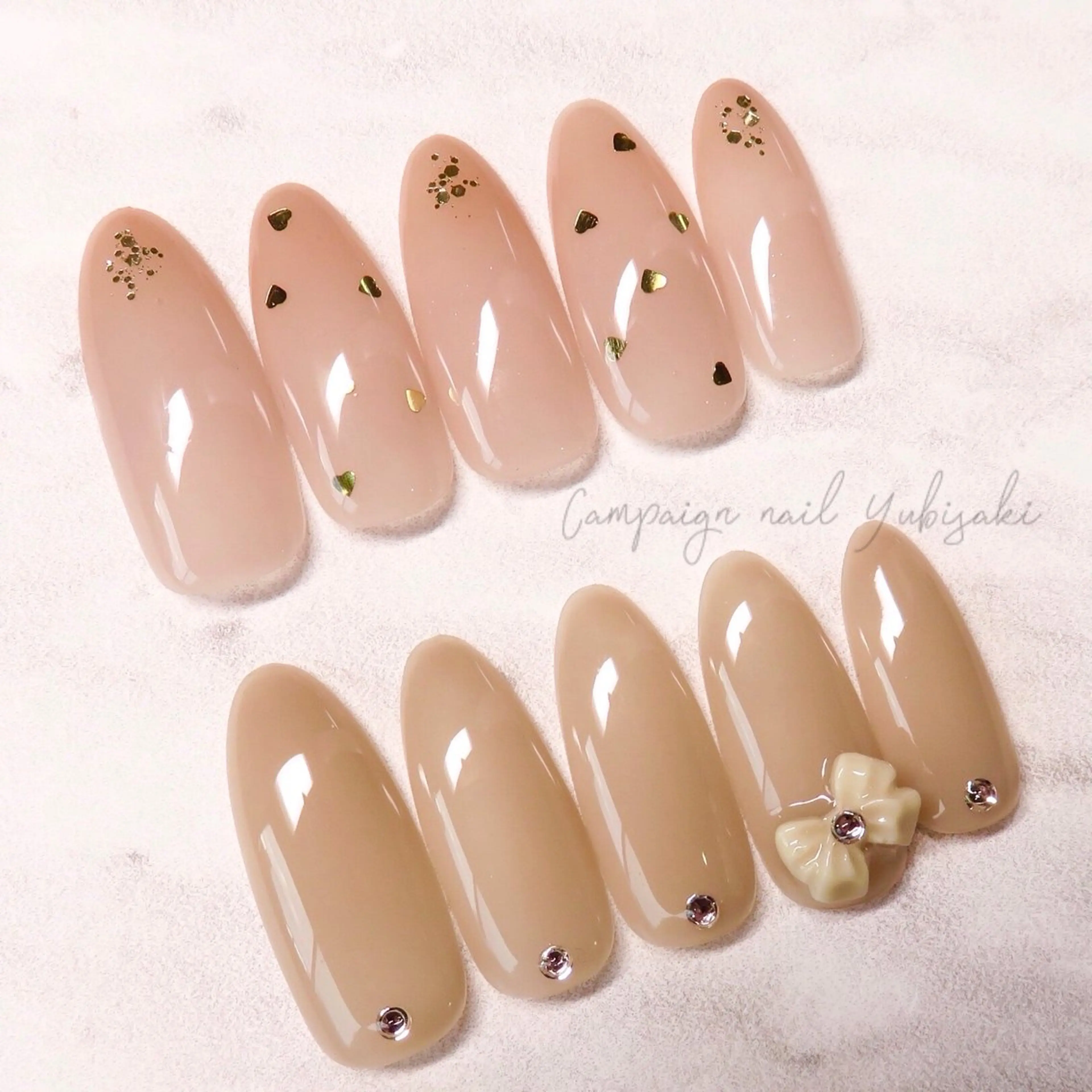 ネイル ゴールド グラデーション ハート 赤色 リボン ﾈｲﾙ/ﾊﾝﾄﾞｹｱ ゆび咲(ﾕﾋﾞｻｷ)のネイルデザイン