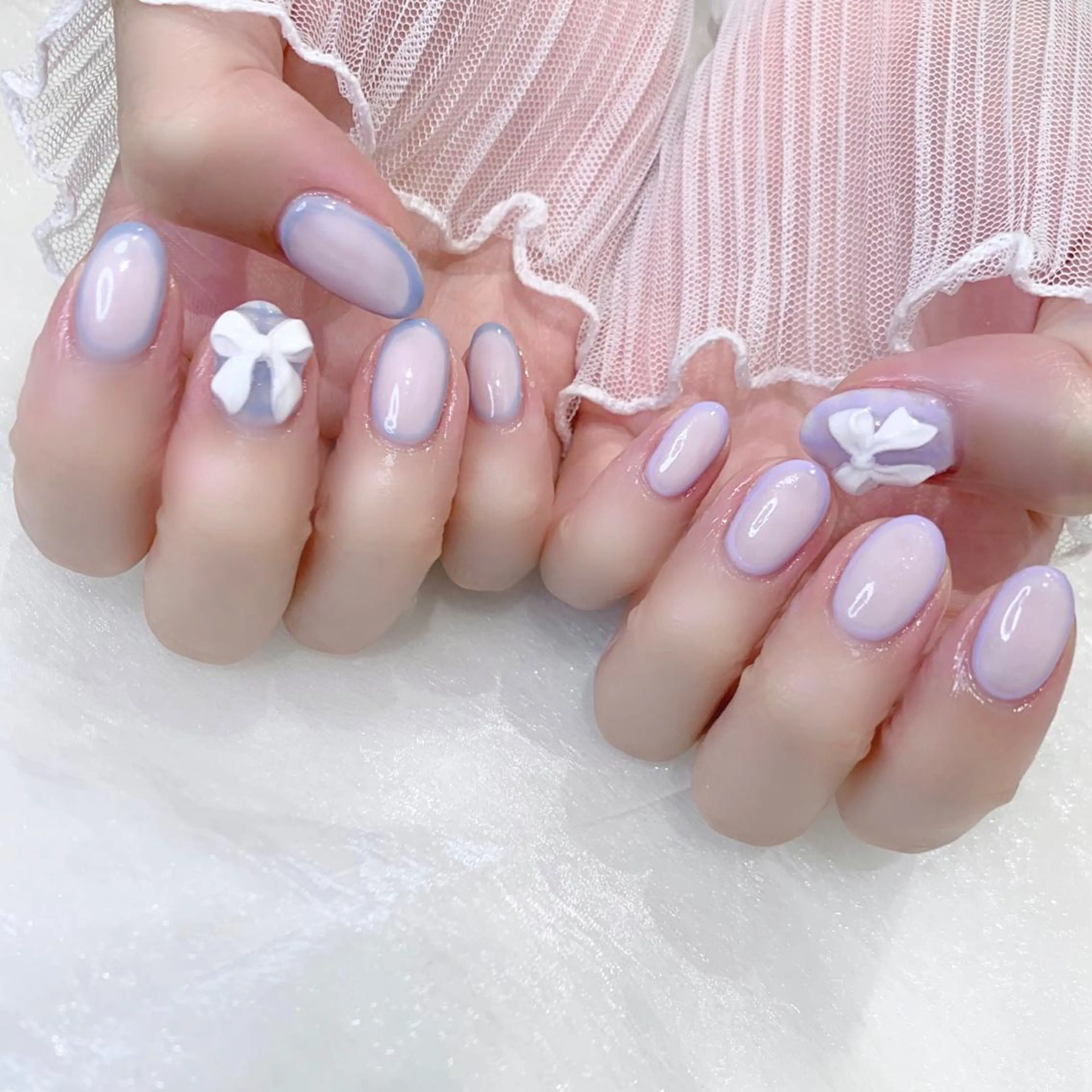 ネイル 水色 パープル リボン ホワイト ハンドネイル Kanon 🤍のネイルデザイン