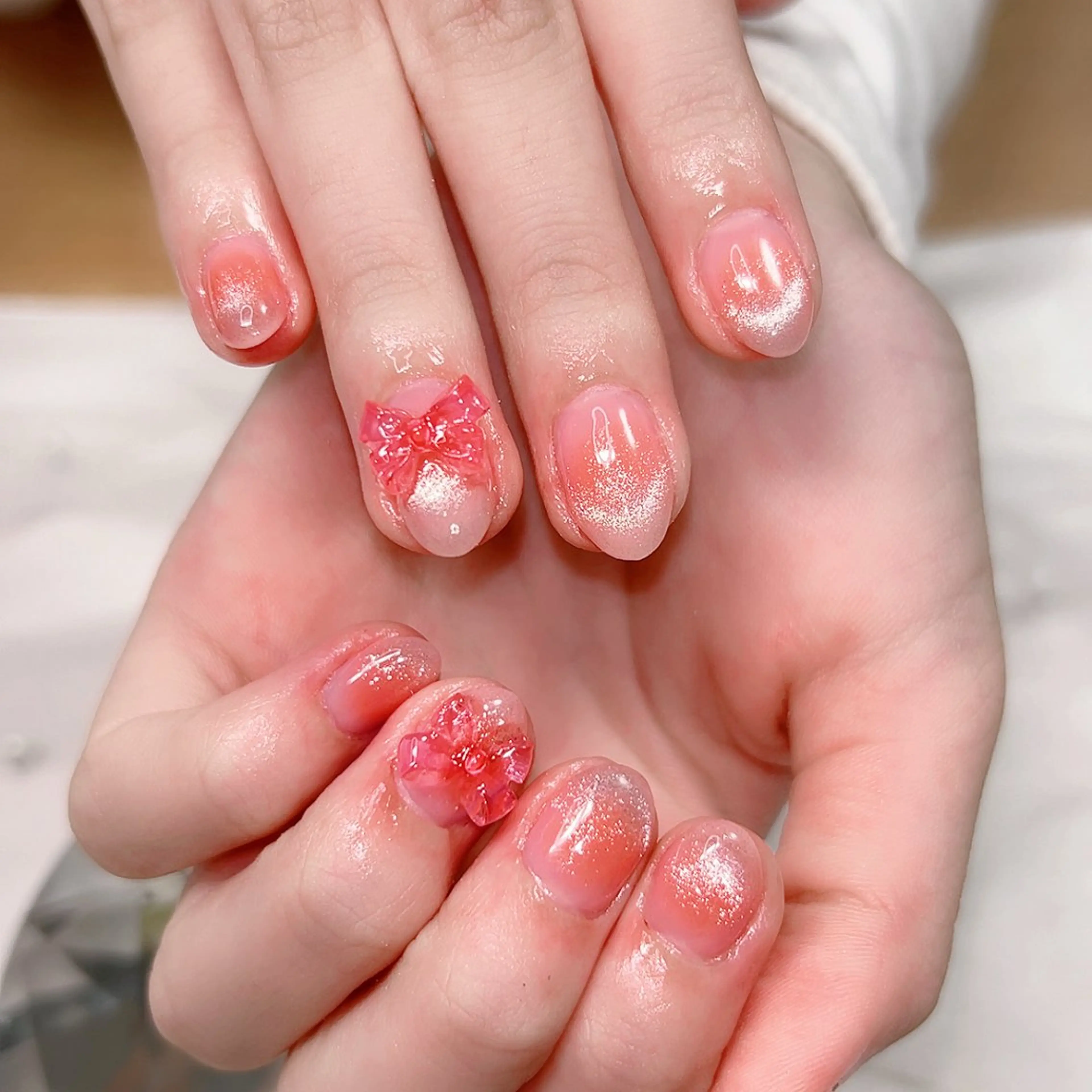 ネイル チークネイル フレンチネイル マグネットネイル ピンク リボン ハンドネイル Cute Tips nailのネイルデザイン