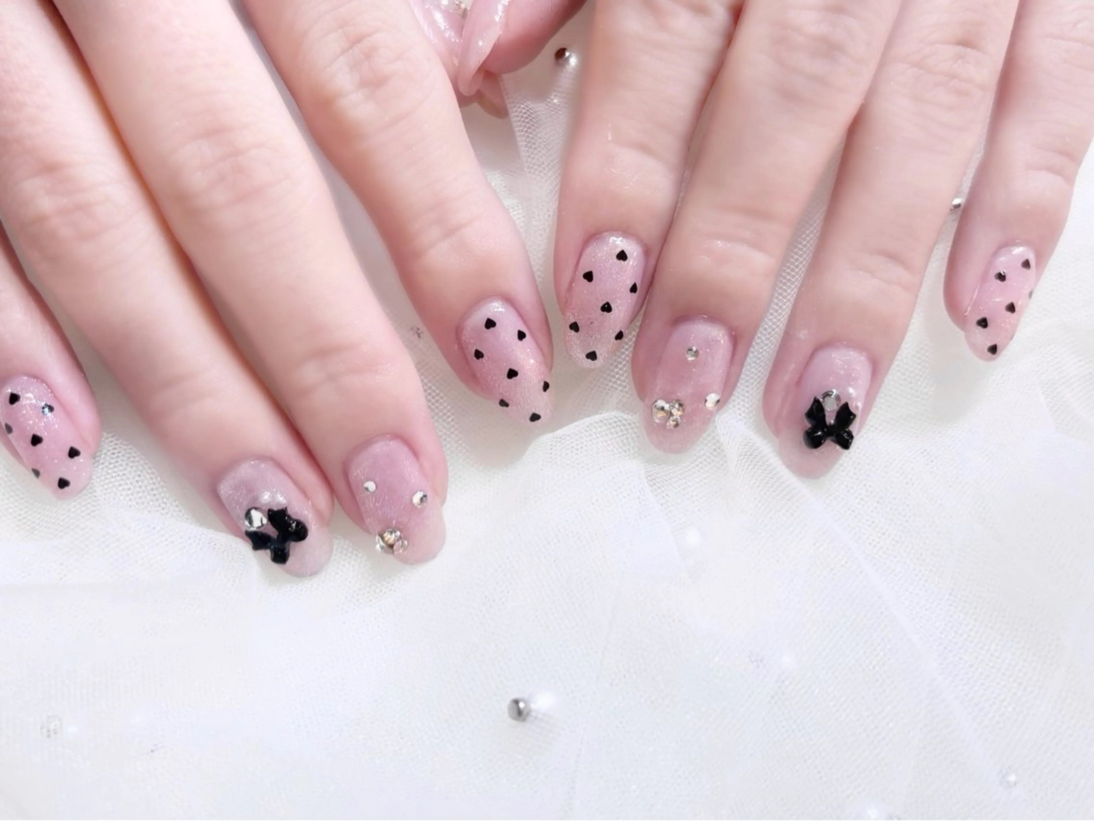 ネイル ガーリー ハート ピンク リボン ワンホンネイル マイノリティbyトップヘアー所属・🎀Minority nail🎀のネイルデザイン