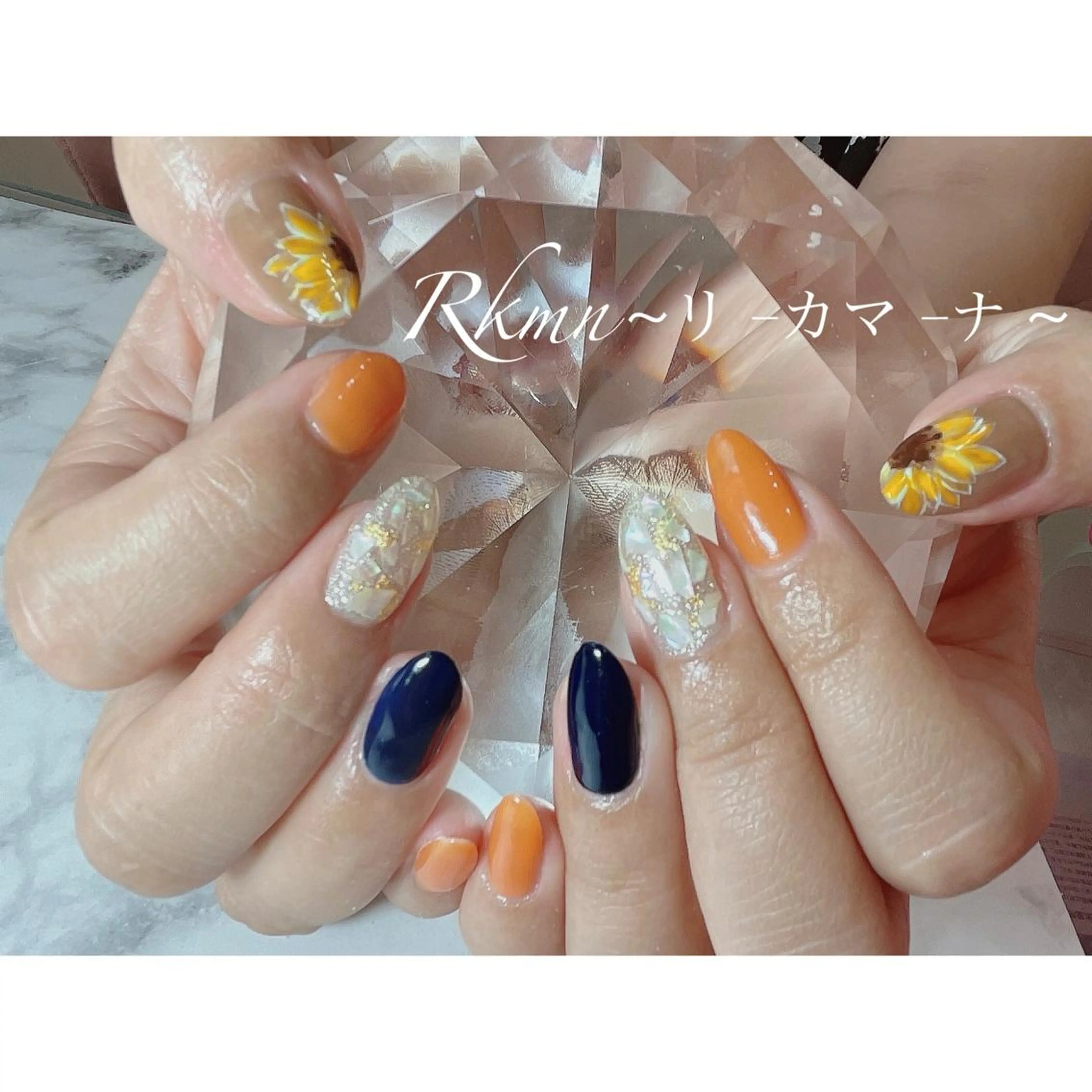 ネイル アートネイル フラワーネイル ネイビー オレンジ 春ネイル ハンドネイル フットネイル ハンドケア Rkmn ~リ-カマ-ナ~のネイルデザイン