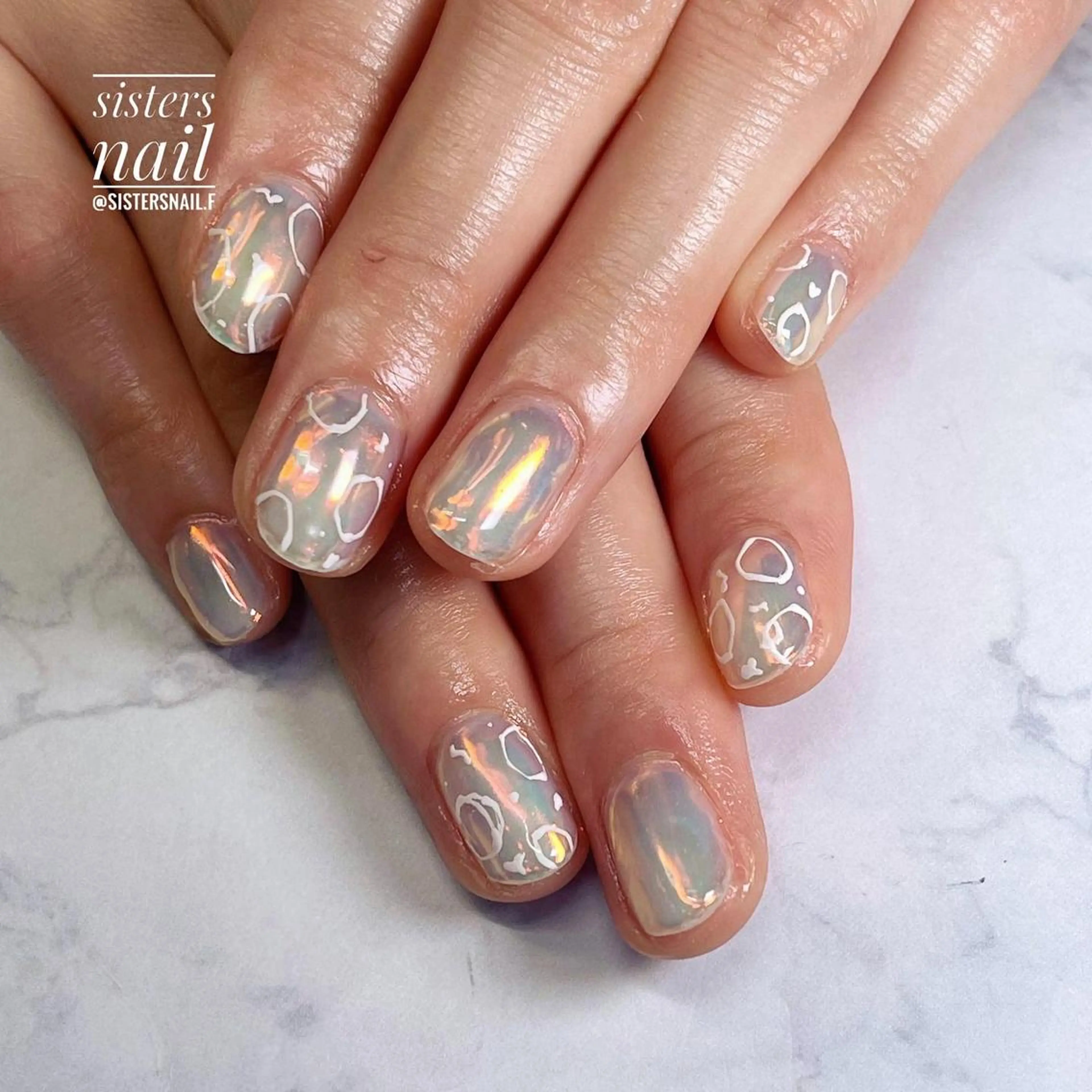 ネイル アートネイル オーロラネイル 氷ネイル・うるうるネイル ニュアンスネイル オレンジ sisters nail.fのネイルデザイン