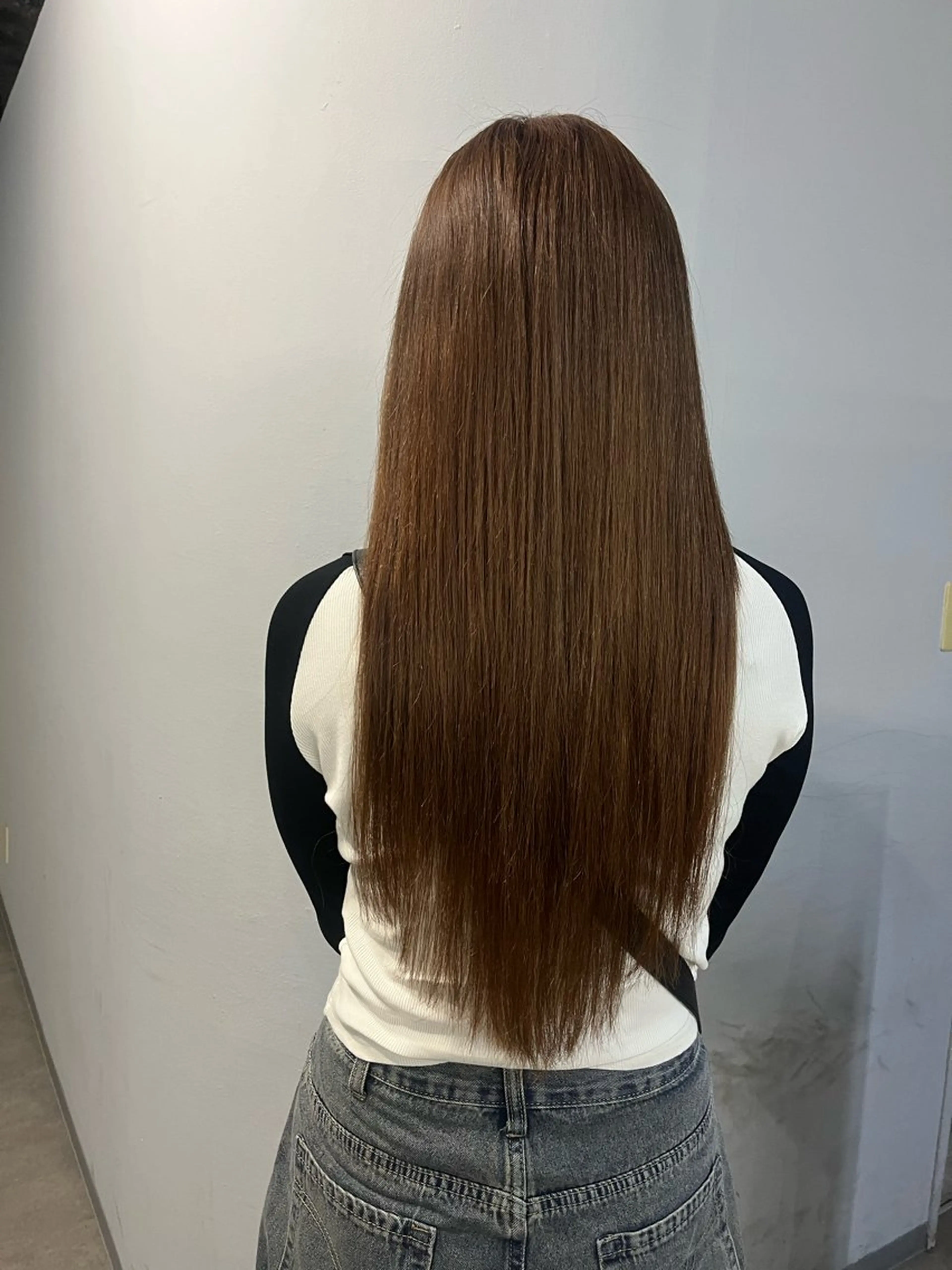 羽エクステ 100本 《馴染ませカット付き》の写真