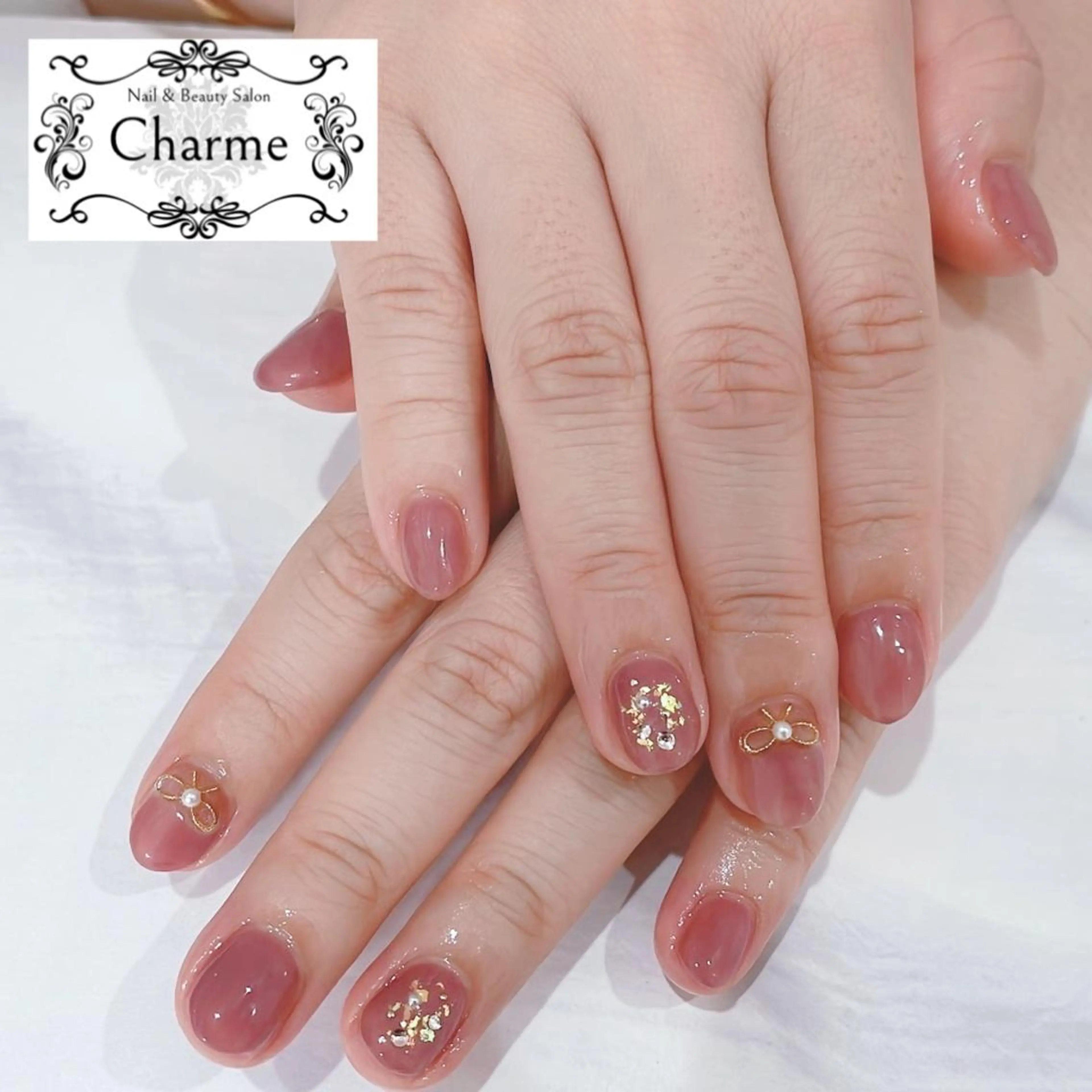 ショート ネイル ピンク リボン Charme -シャルム-のネイルデザイン