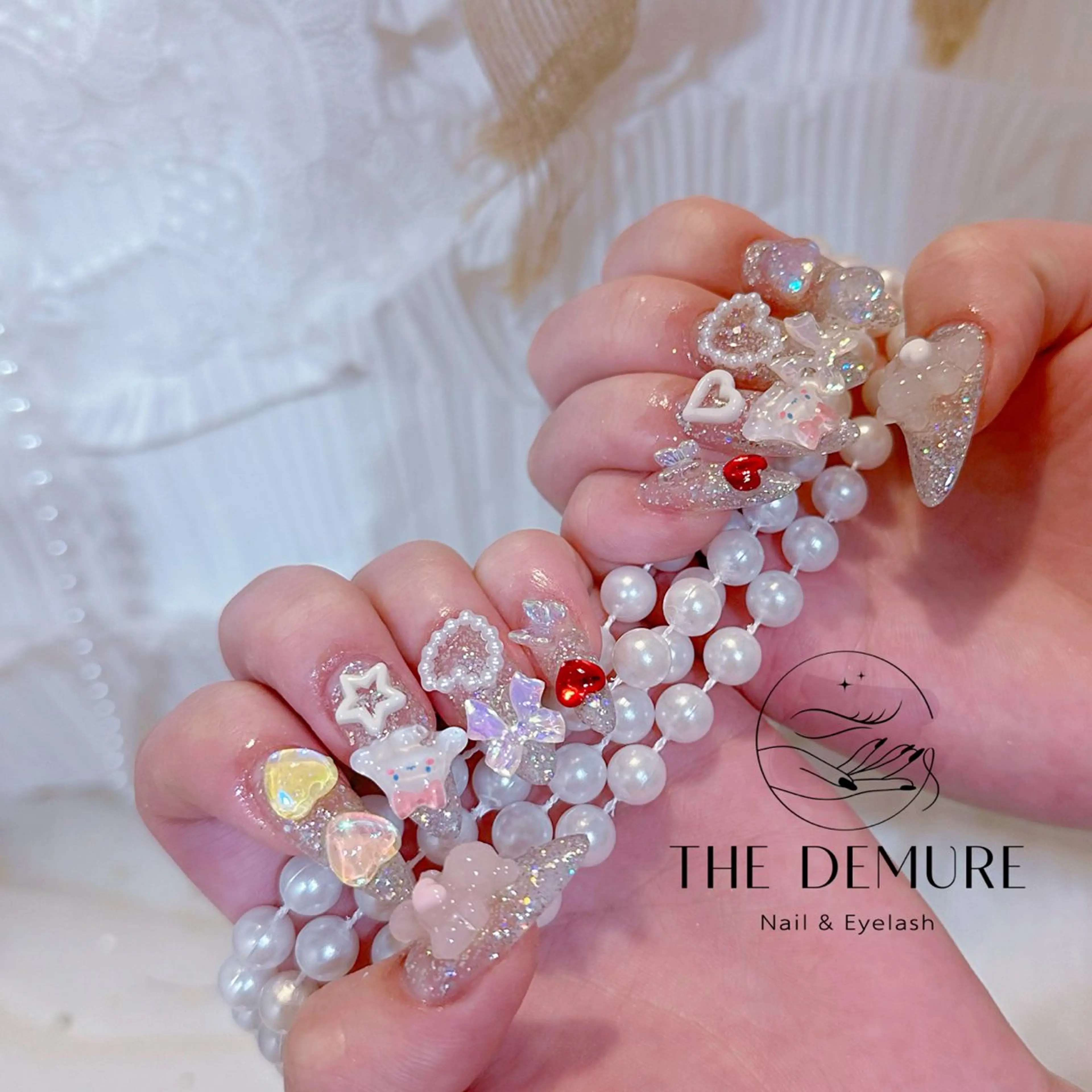 ネイル アートネイル キラキラネイル 韓国ネイル 水色 ロングネイル ハンドネイル ハンドケア NailDemure 【銀座店】のネイルデザイン