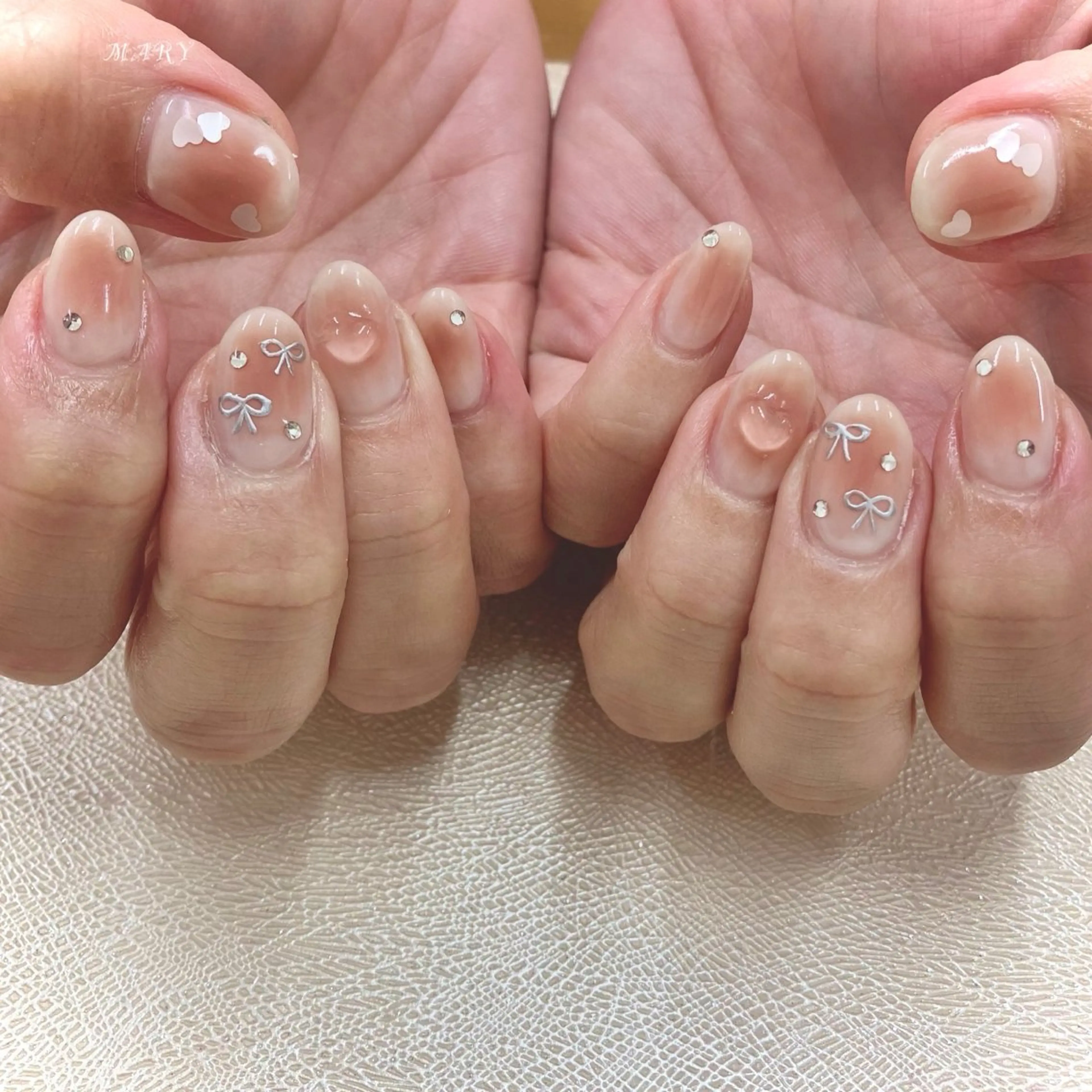 ネイル チークネイル ハート ニュアンスネイル ピンク リボン ハンドネイル Mary nail所属・Mary nail .narumiのネイルデザイン