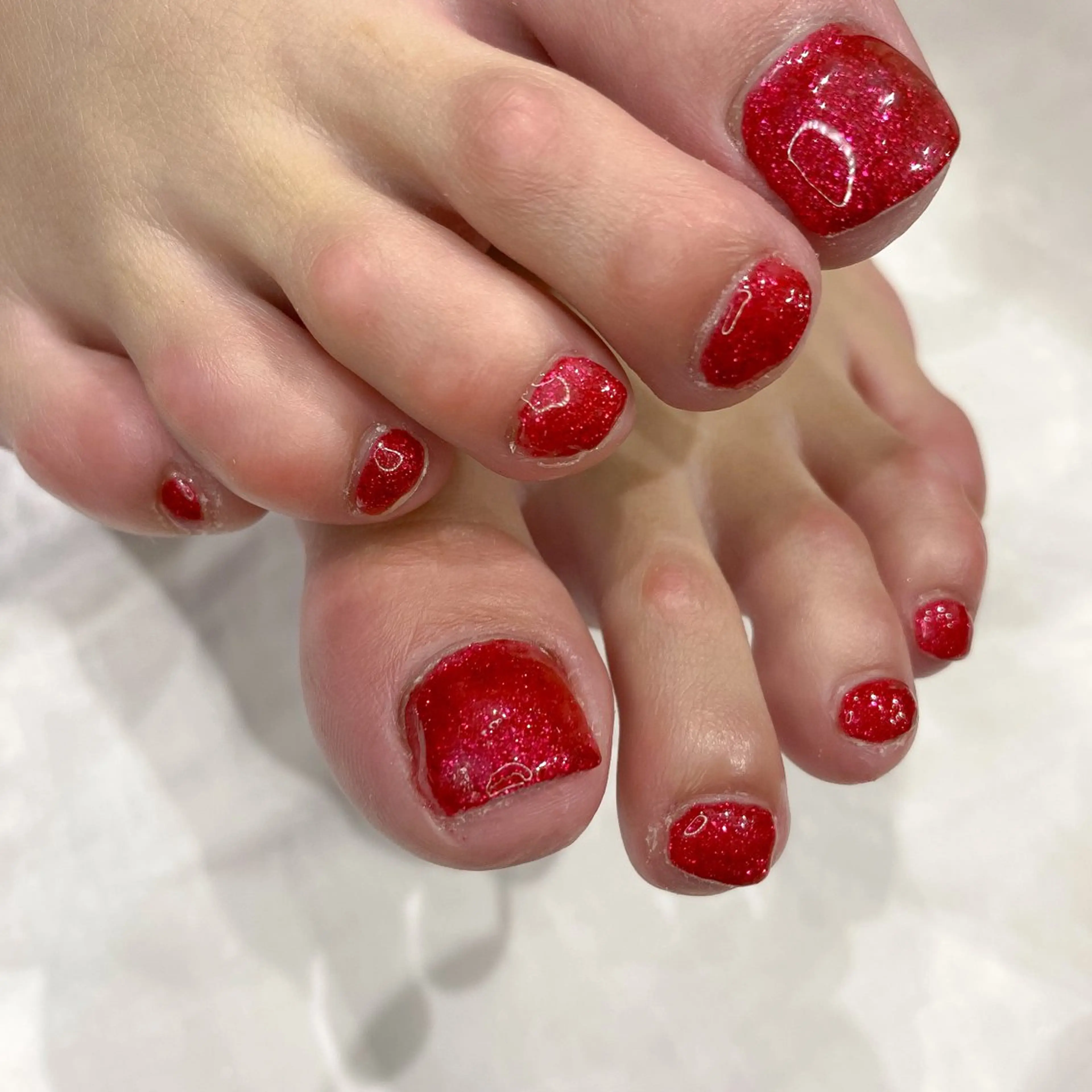 ネイル フットネイル 赤色 ネイル空間所属・muguet🎀 nailのネイルデザイン
