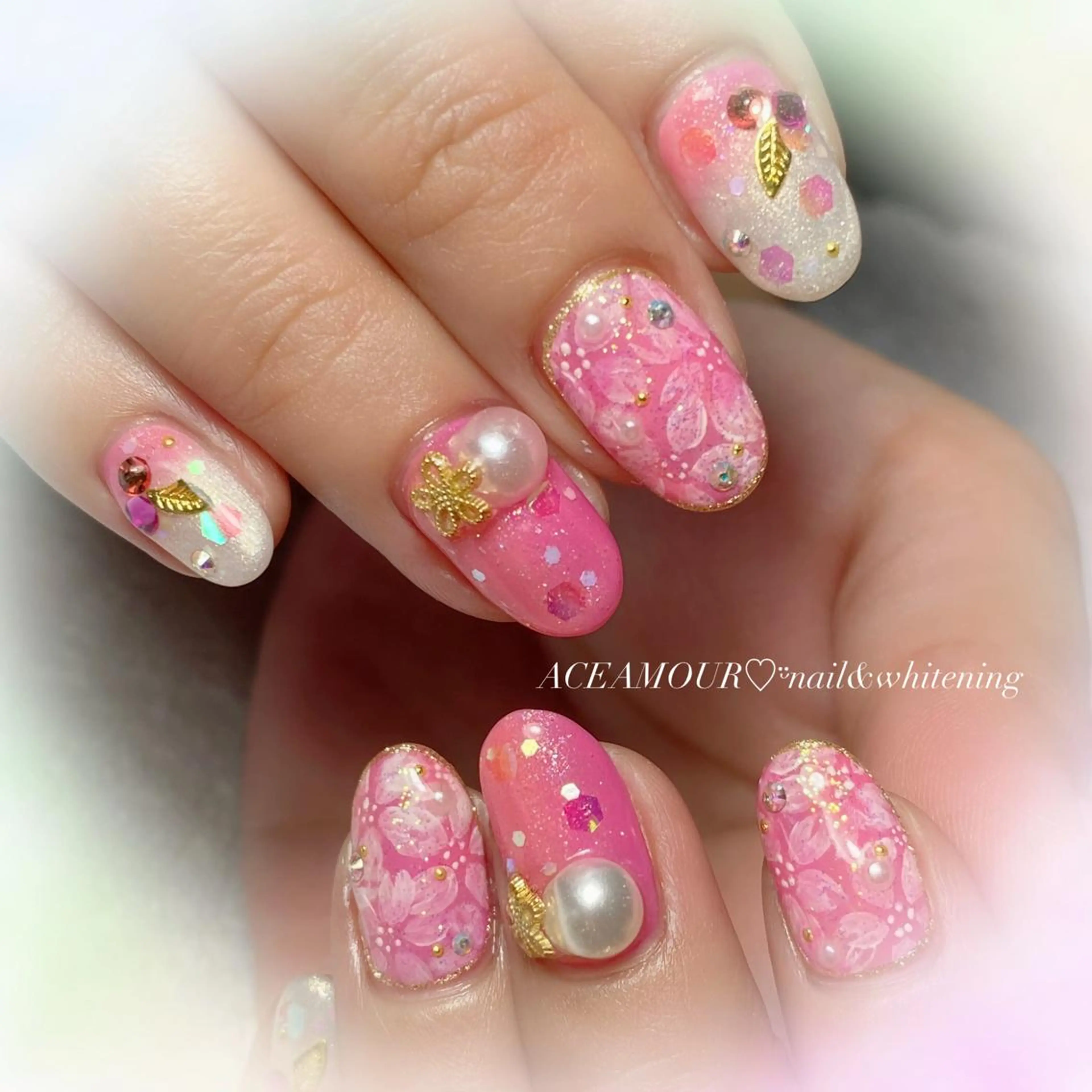 ネイル アートネイル 桜ネイル キラキラネイル 春ネイル ネイル/耳つぼ /新ホワイトニングのネイルデザイン