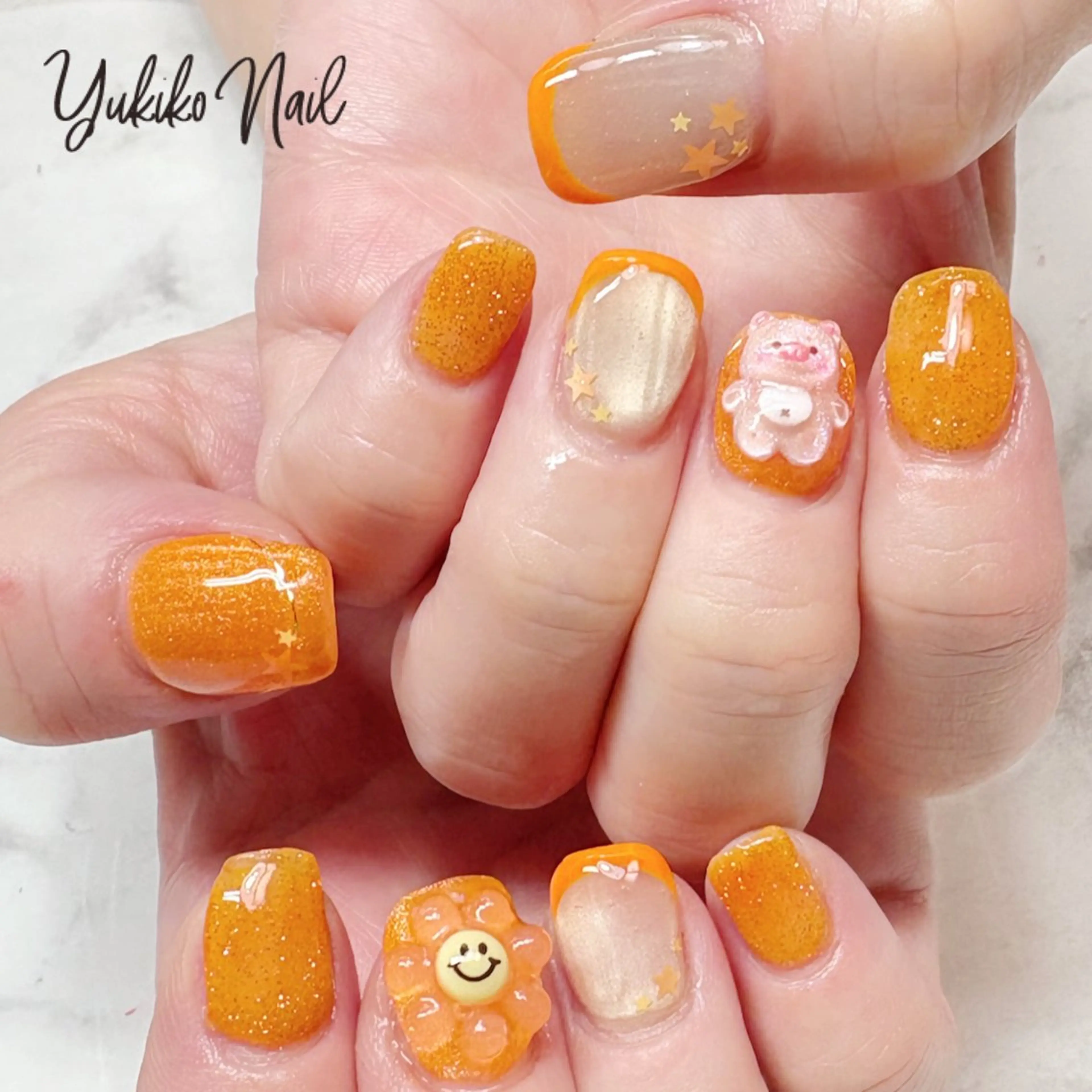 ネイル フラッシュネイル フラワーネイル フレンチネイル キラキラネイル オレンジ ハンドネイル ユキコ ネイルのネイルデザイン