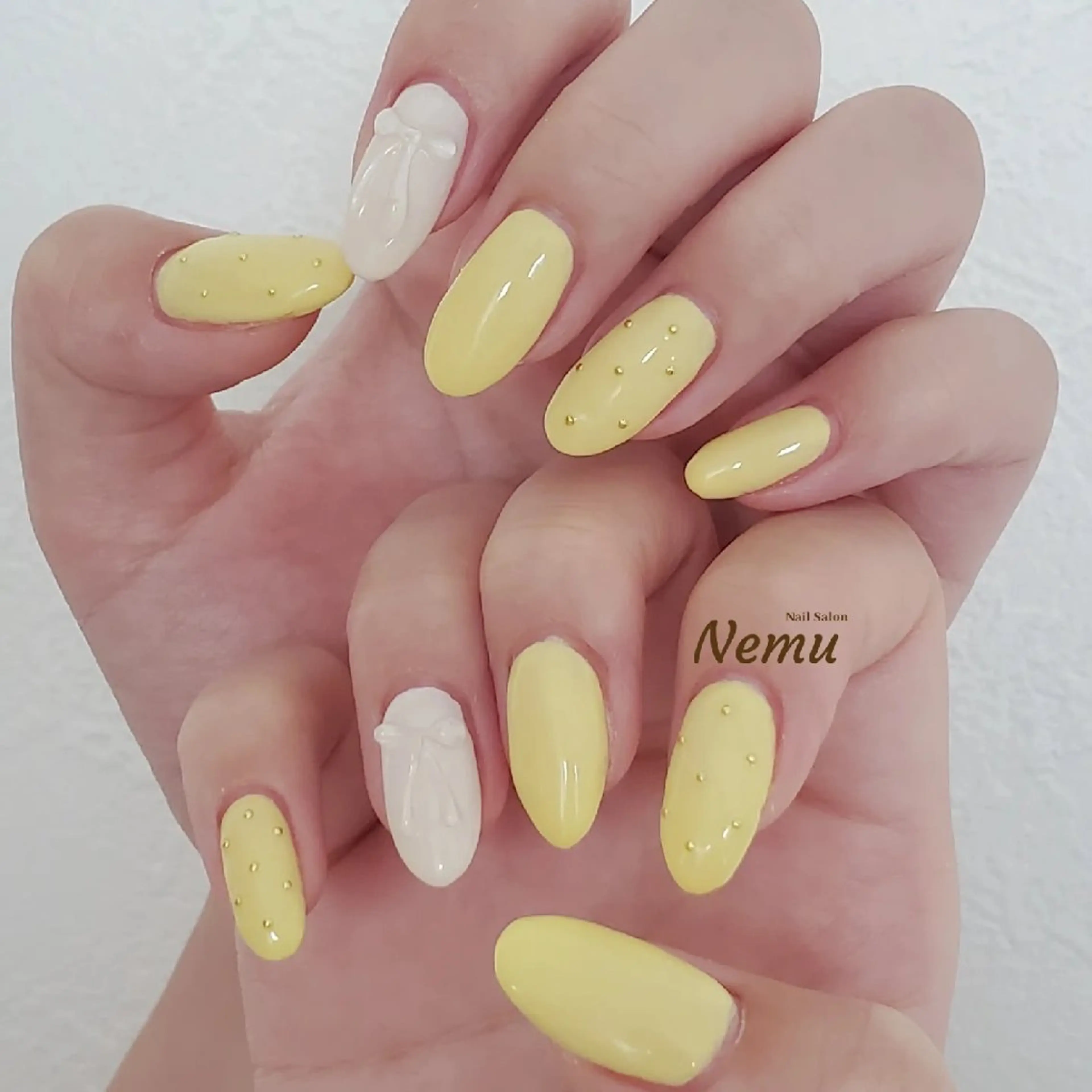 ネイル クリアネイル 持ち込み パステルネイル リボン 黄色 YASUNAGA HIROMIのネイルデザイン