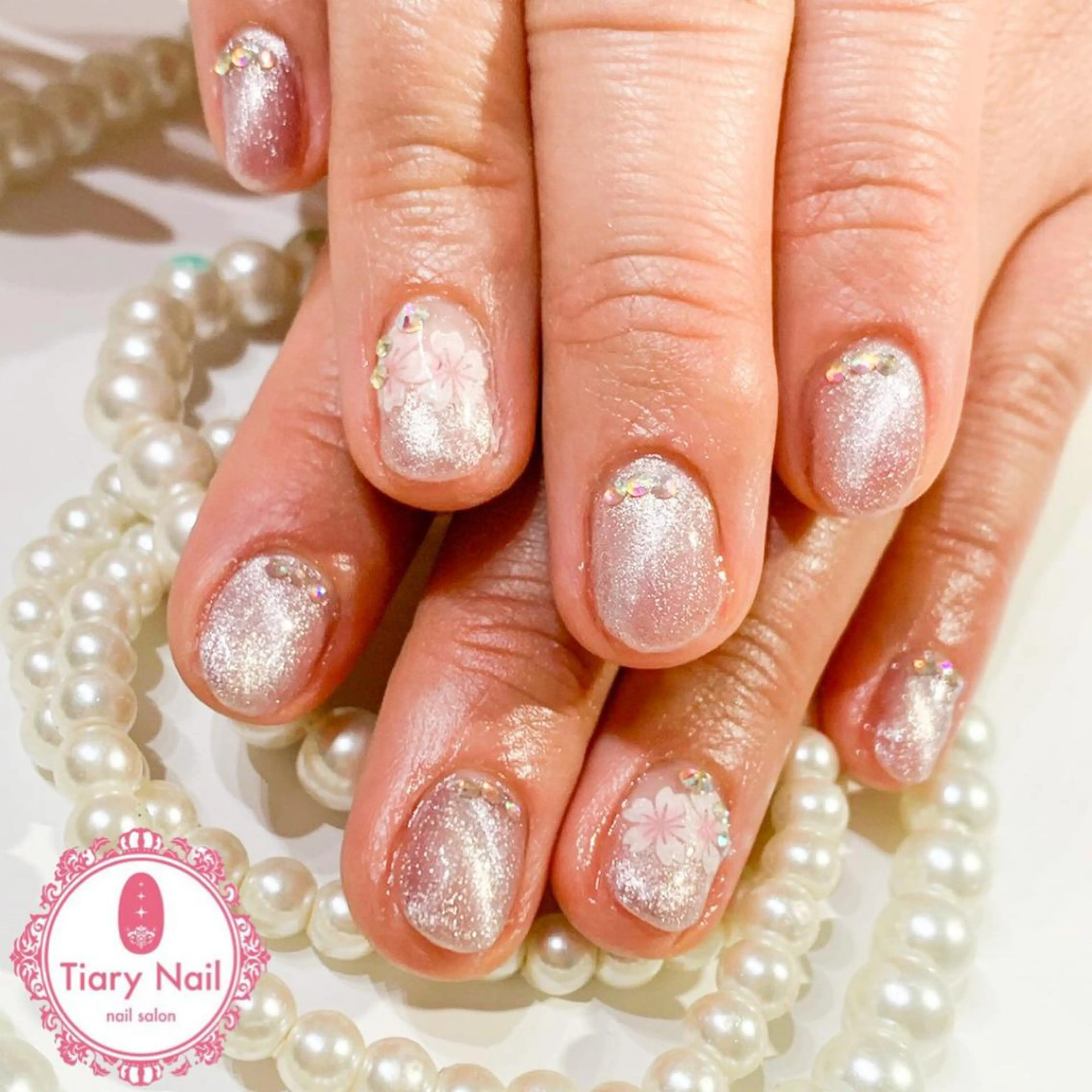 ネイル 桜ネイル クリアネイル フットネイル ジェルネイル キラキラネイル ハンドネイル 💗🪽Tiary Nail🪽💗のネイルデザイン