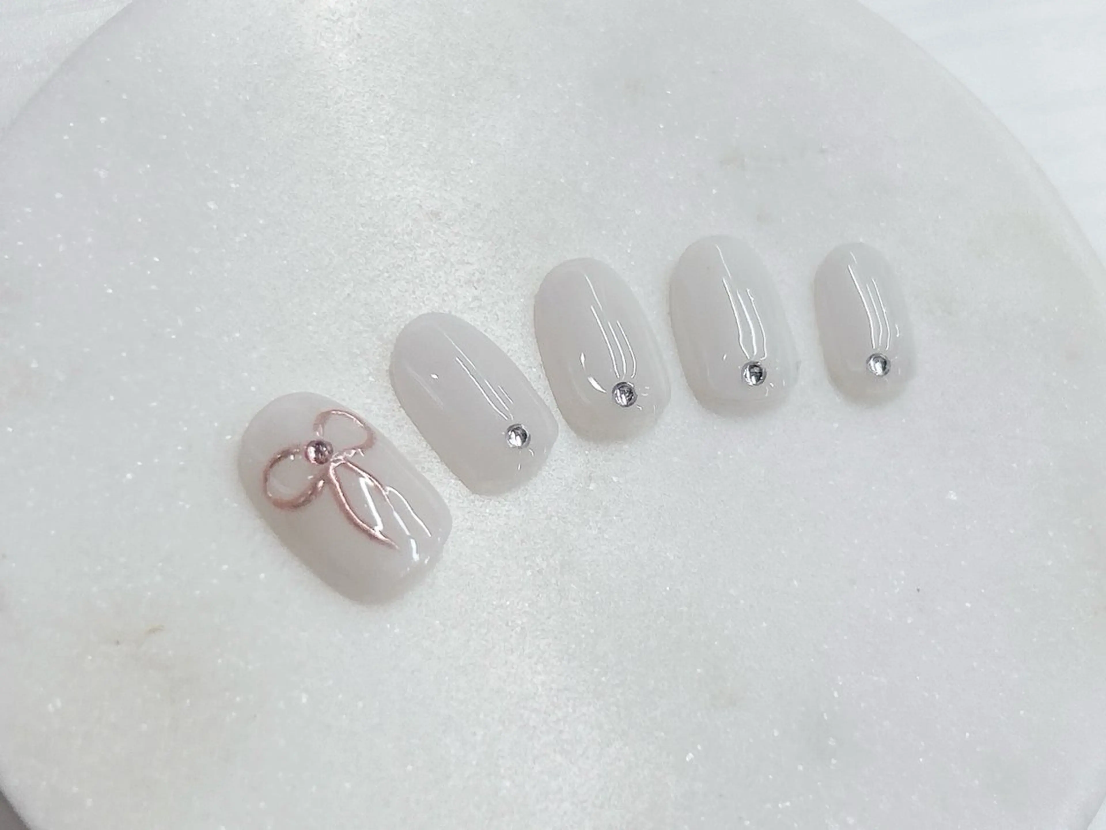 ネイル 桜ネイル ガーリー オフィスネイル ピンク リボン ハンドネイル Forca total studio所属・Forca Airaのネイルデザイン