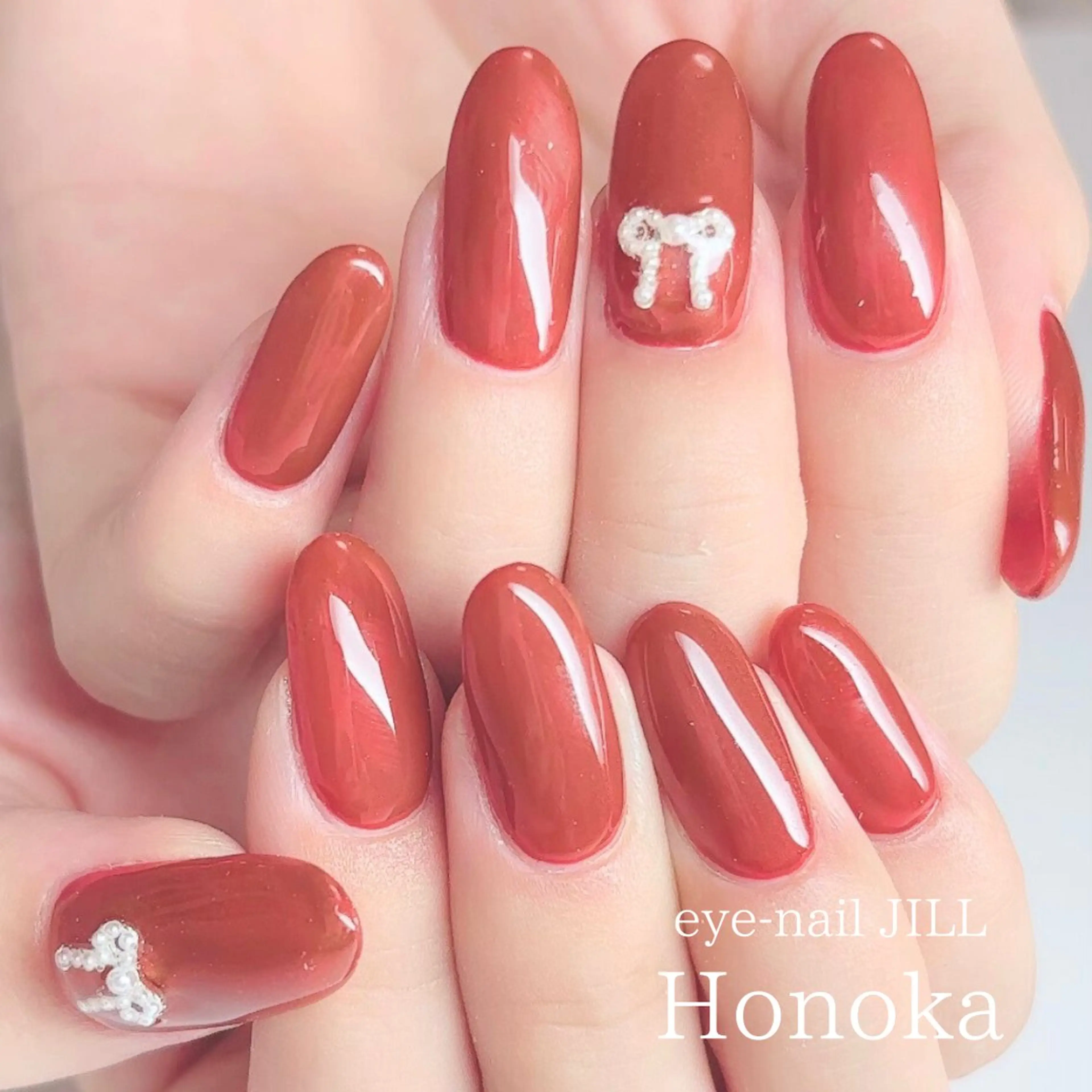 ネイル ワンカラーネイル 赤色 リボン ハンドネイル JILL Honokaのネイルデザイン