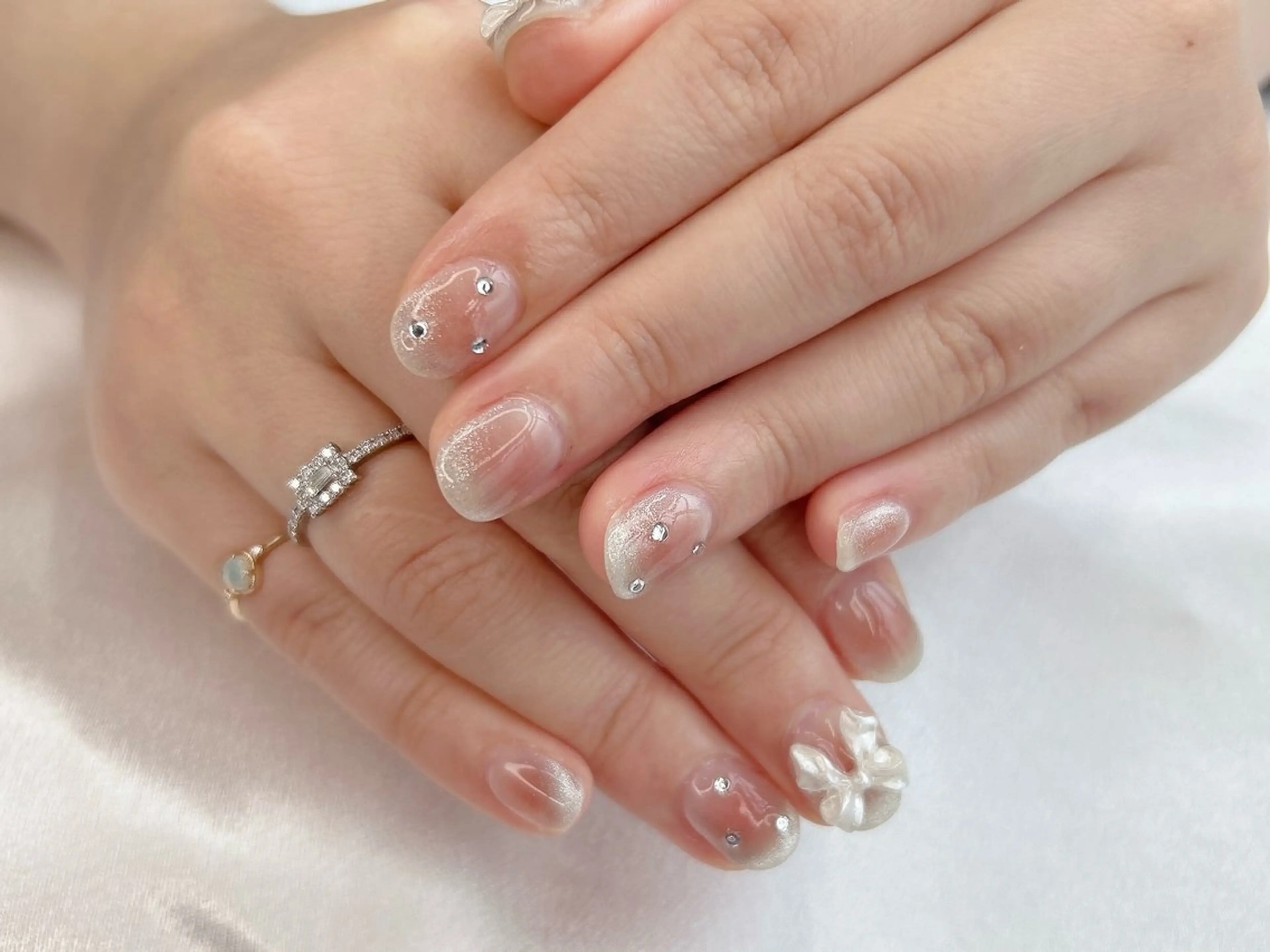 ネイル チークネイル 桜ネイル ピンク リボン ショートネイル ハンドネイル Forca total studio所属・Forca Airaのネイルデザイン