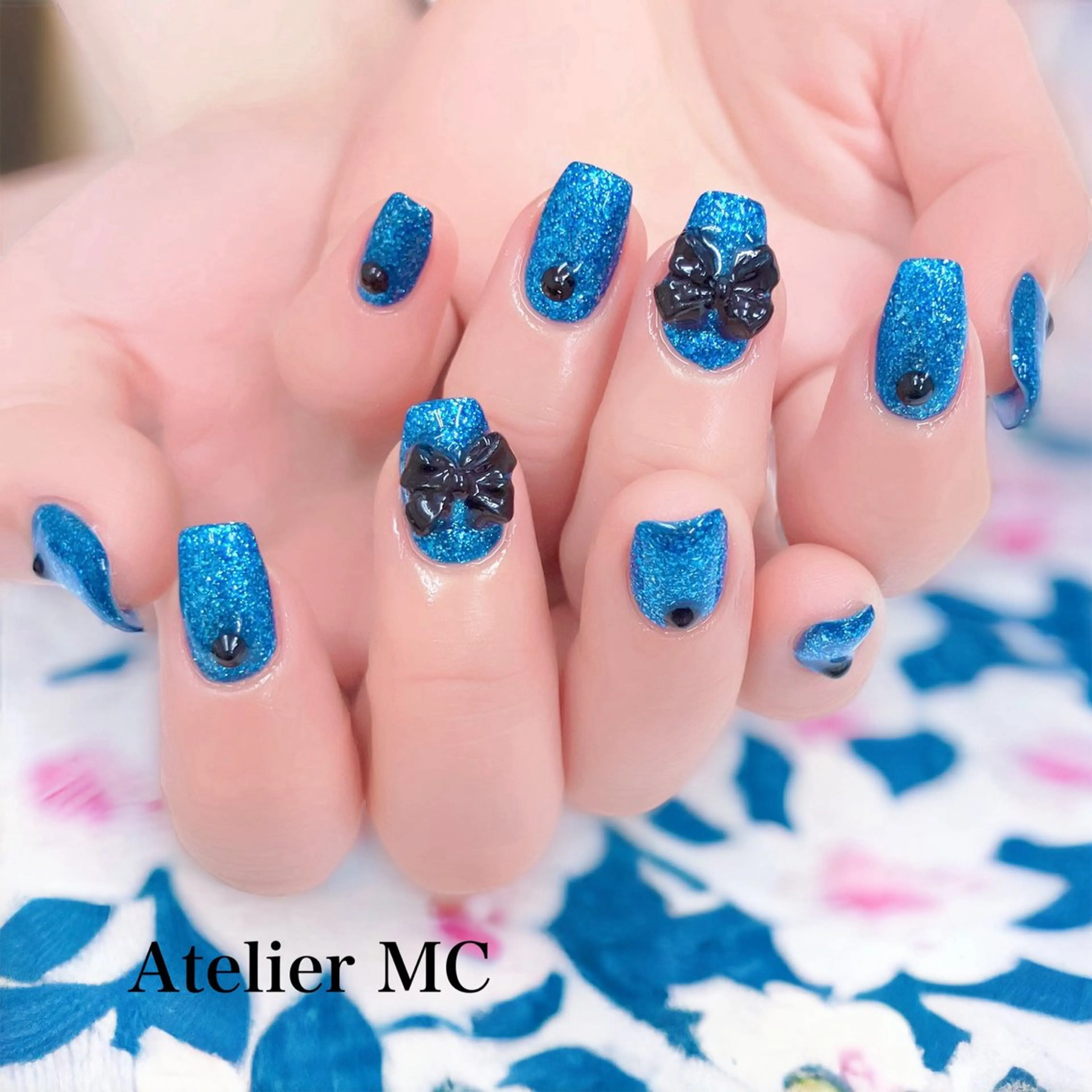 🎀リボン最強説🩵推しメンカラーでリボンネイル🎀の写真