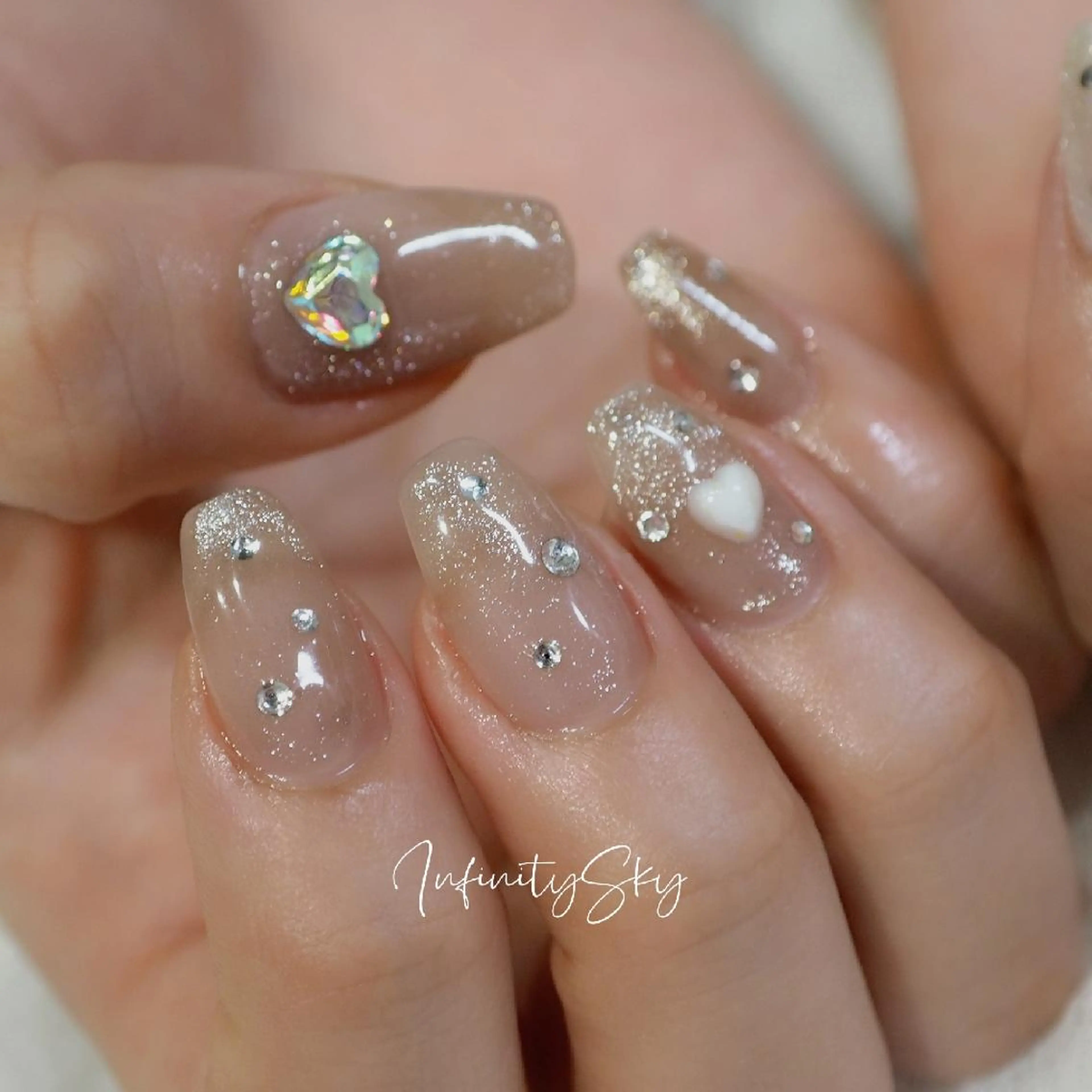 ネイル ブラウン クリアネイル キラキラネイル ラメ(グリッター) ストーンネイル infinity skyのネイルデザイン