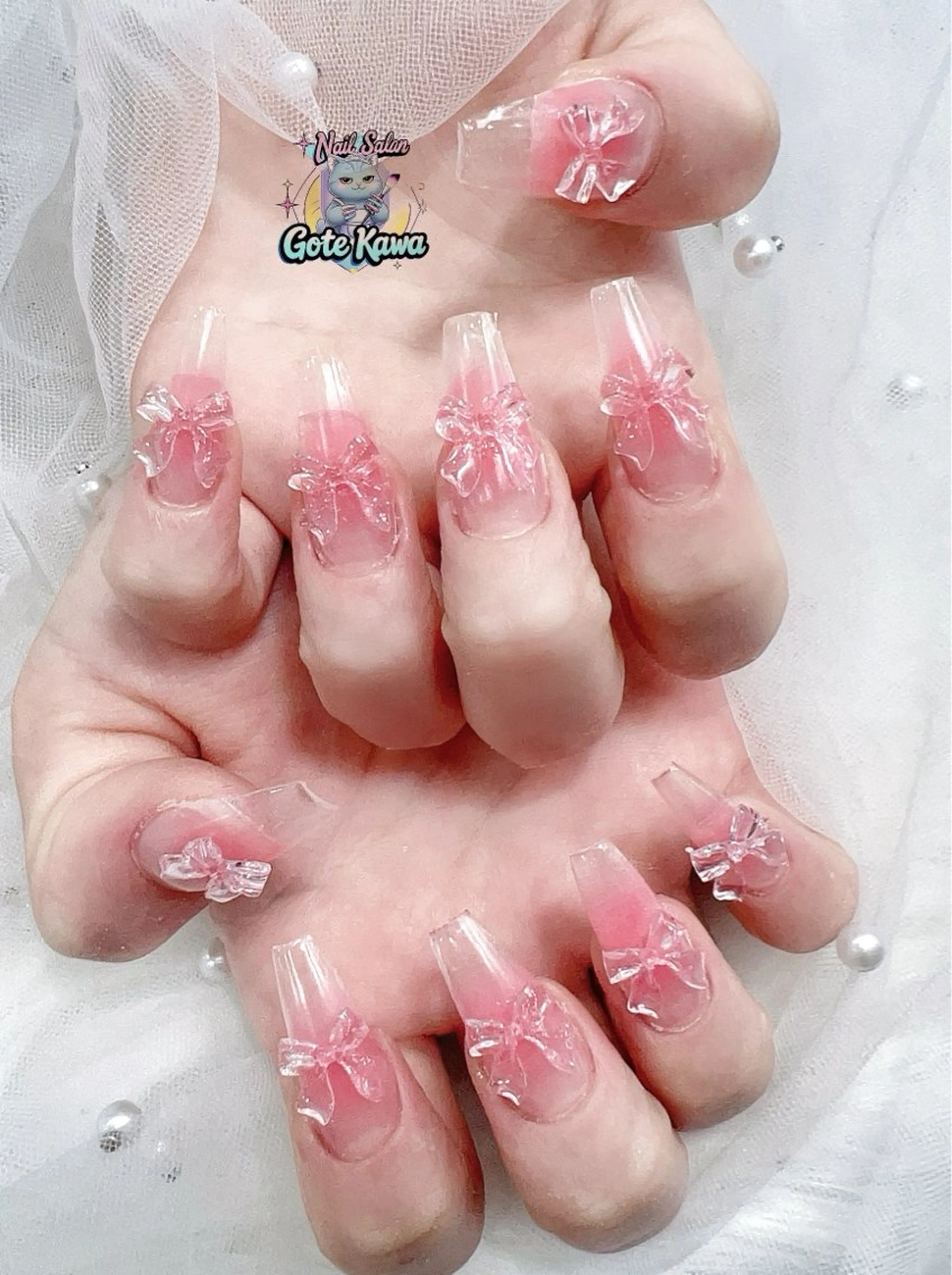 ネイル アートネイル 長さ出し キラキラネイル ピンク リボン ハンドネイル ハンドケア GOTE KAWA Nail Salon(ゴテかわ)所属・Gote Kawa nail salonのネイルデザイン