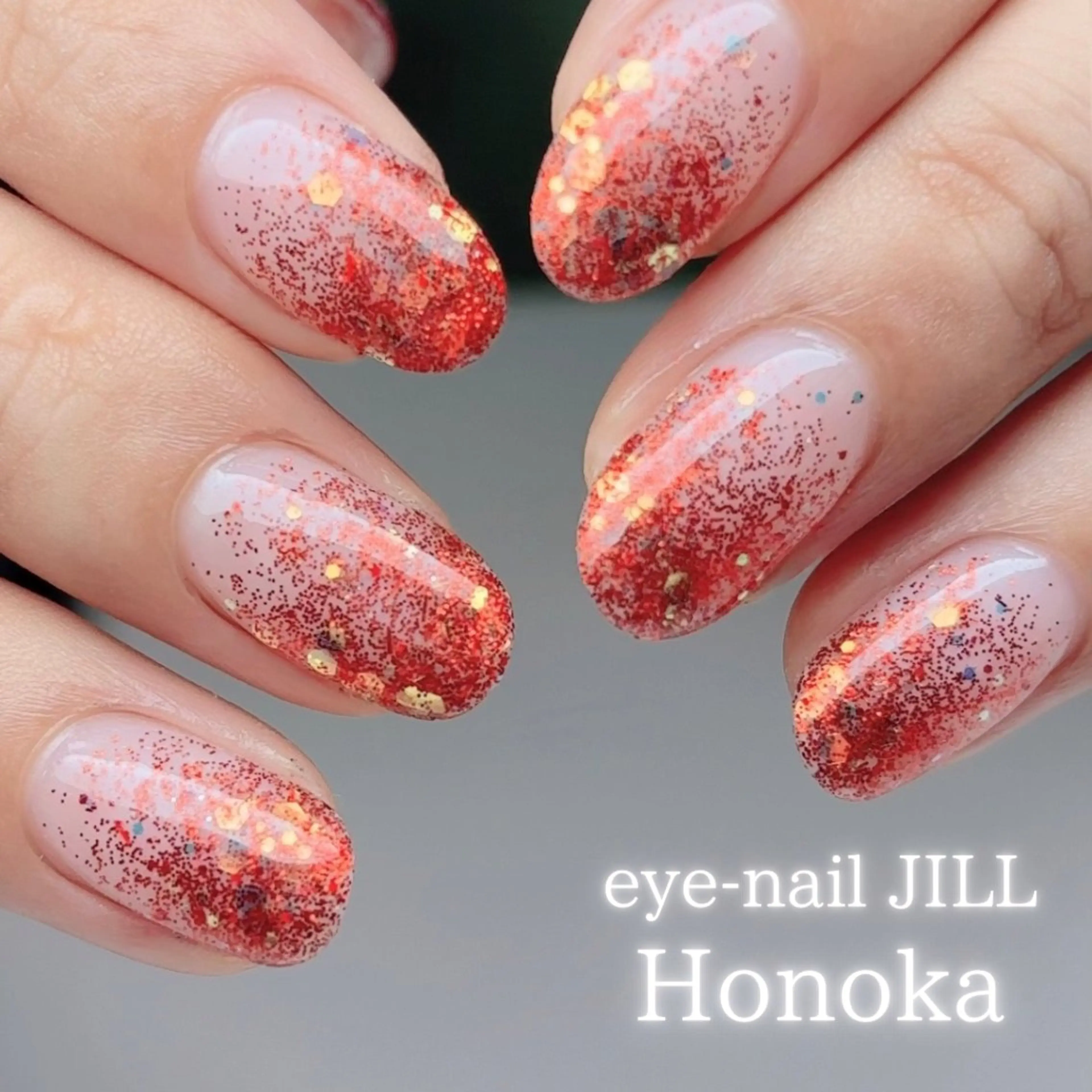 ネイル グラデーション ラメ(グリッター) ラメグラデーション 赤色 ハンドネイル JILL Honokaのネイルデザイン