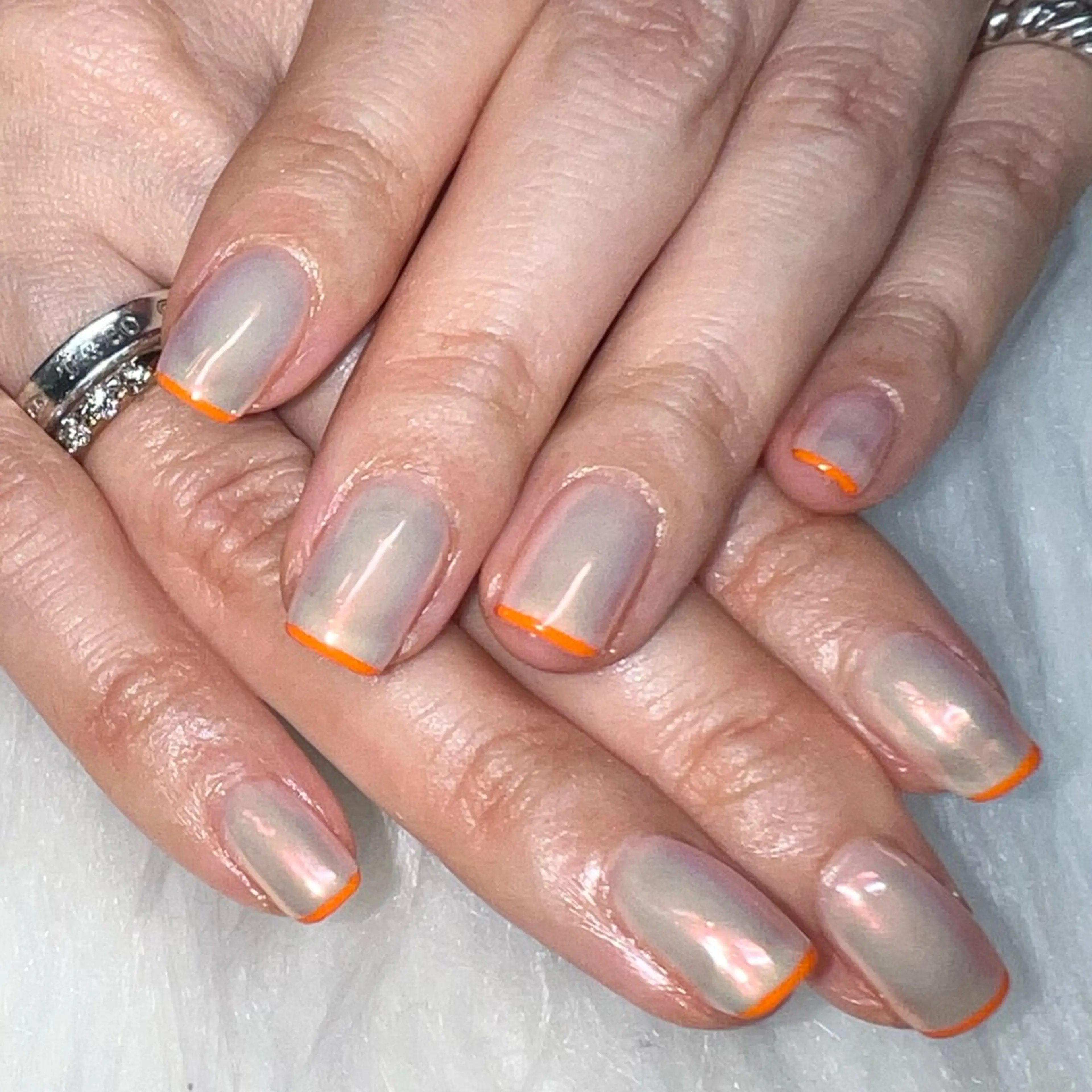 ネイル アートネイル オーロラネイル オレンジ ハンドネイル Nail&Eyelash salon Axia所属・Nail salon Axiaのネイルデザイン