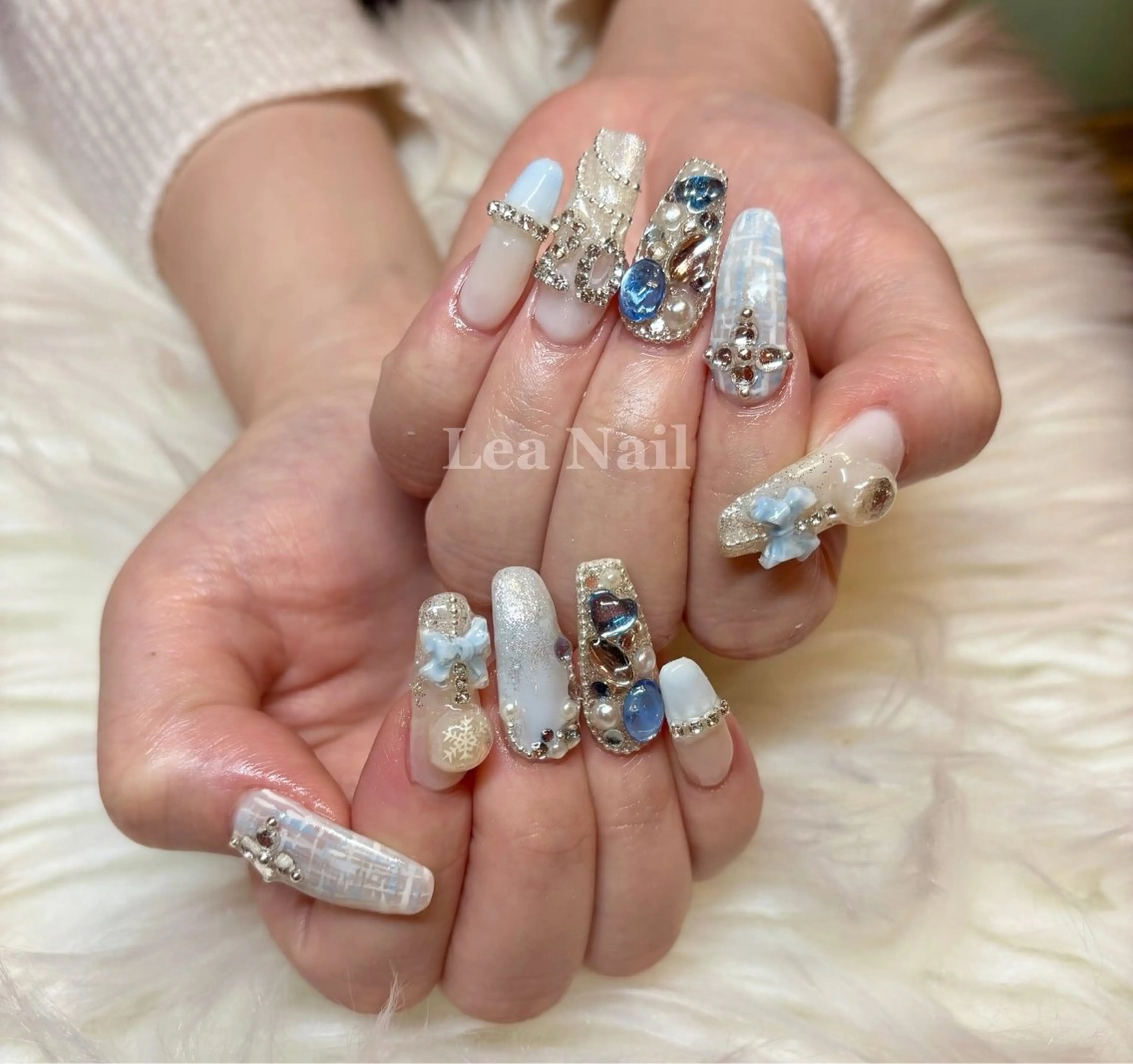 ネイル 成人式 水色 リボン ストーンネイル Lea Nailのネイルデザイン