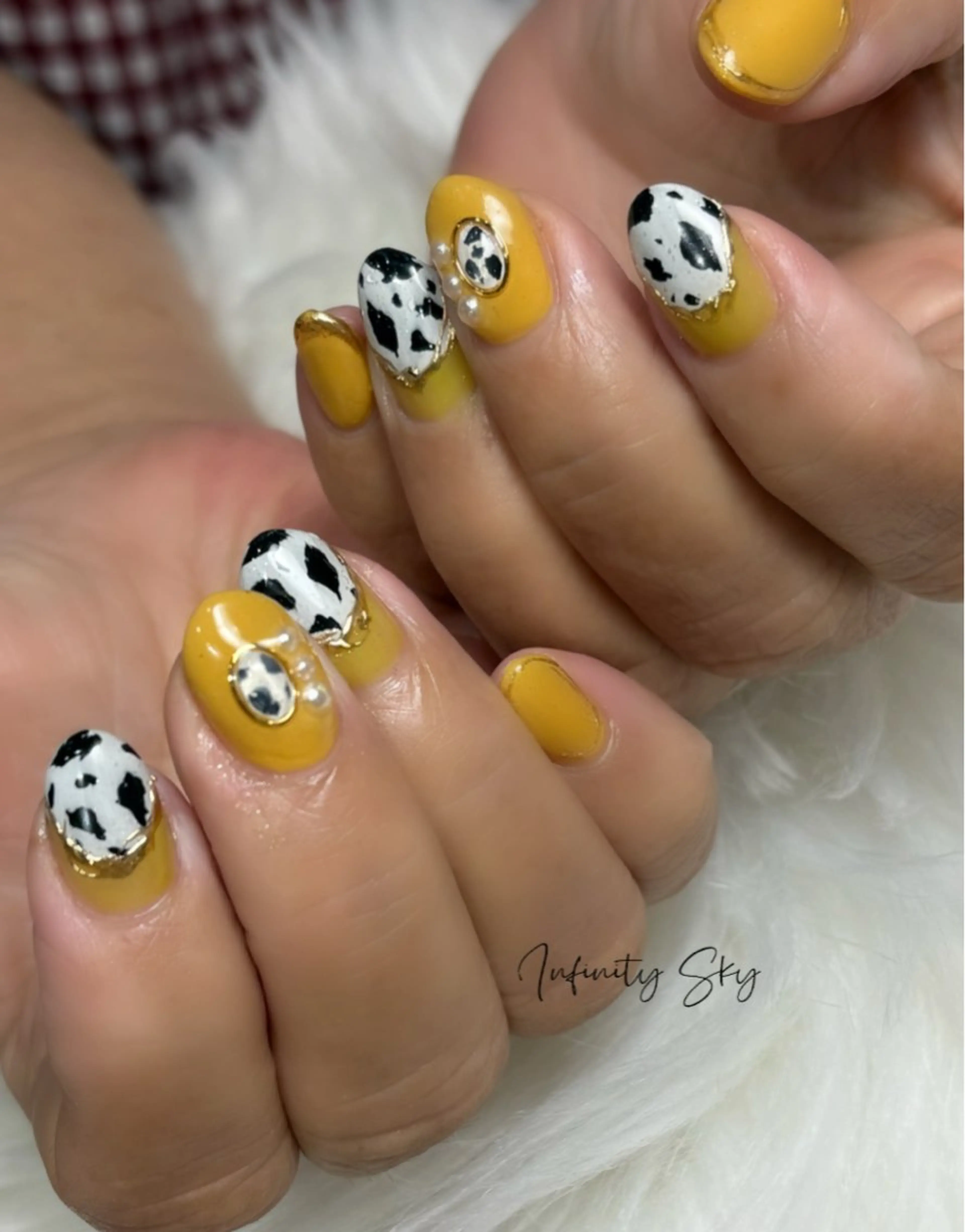 ネイル アニマル柄 黄色 infinity skyのネイルデザイン