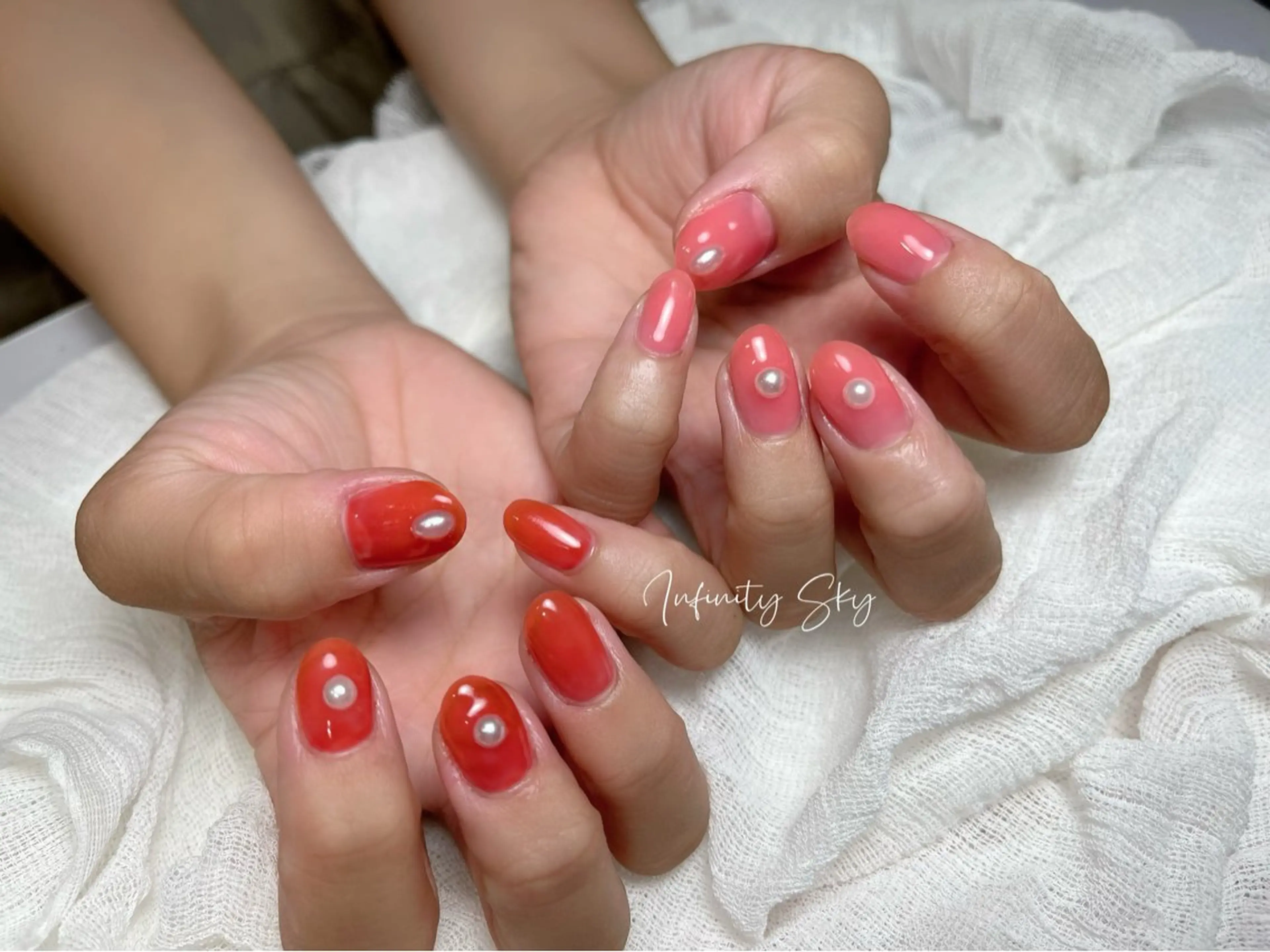 ネイル クリアネイル オレンジ ピンク ハンドネイル infinity skyのネイルデザイン