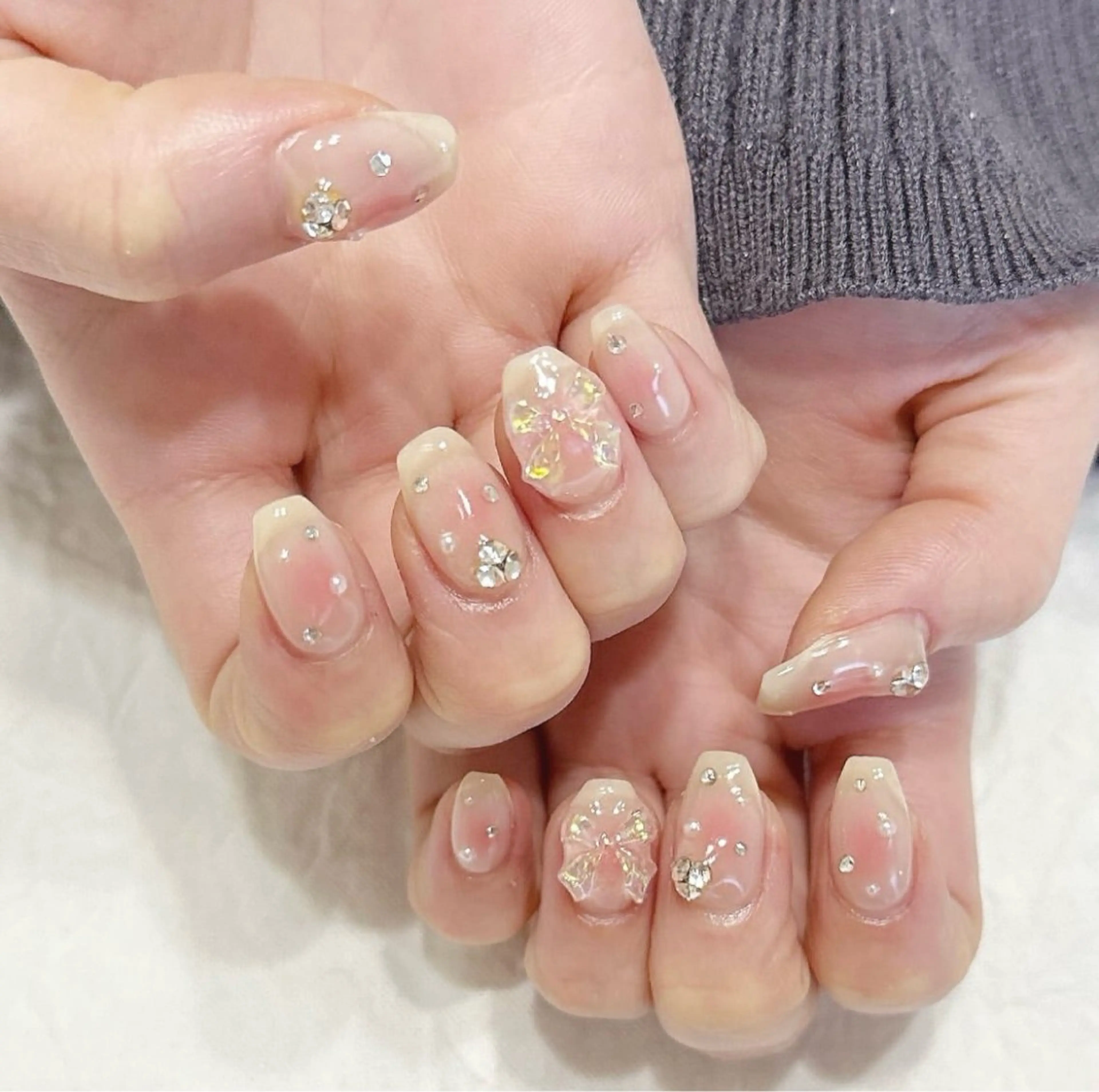 ネイル オーロラネイル チークネイル ピンク リボン ストーンネイル ハンドネイル peaberry nailのネイルデザイン