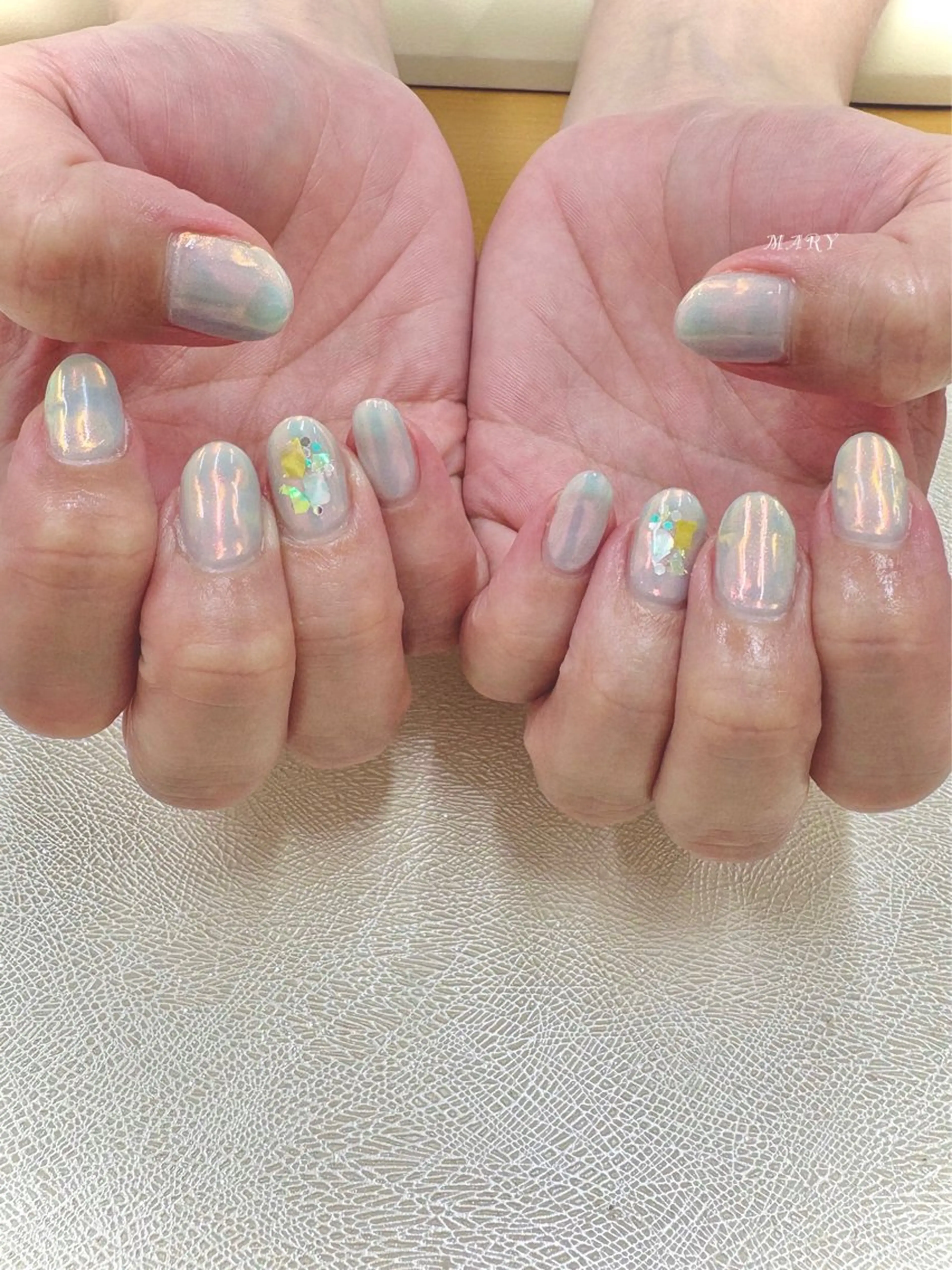 ネイル オーロラネイル 水色 ニュアンスネイル ワンカラーネイル オレンジ ハンドネイル Mary nail所属・Mary nail .narumiのネイルデザイン