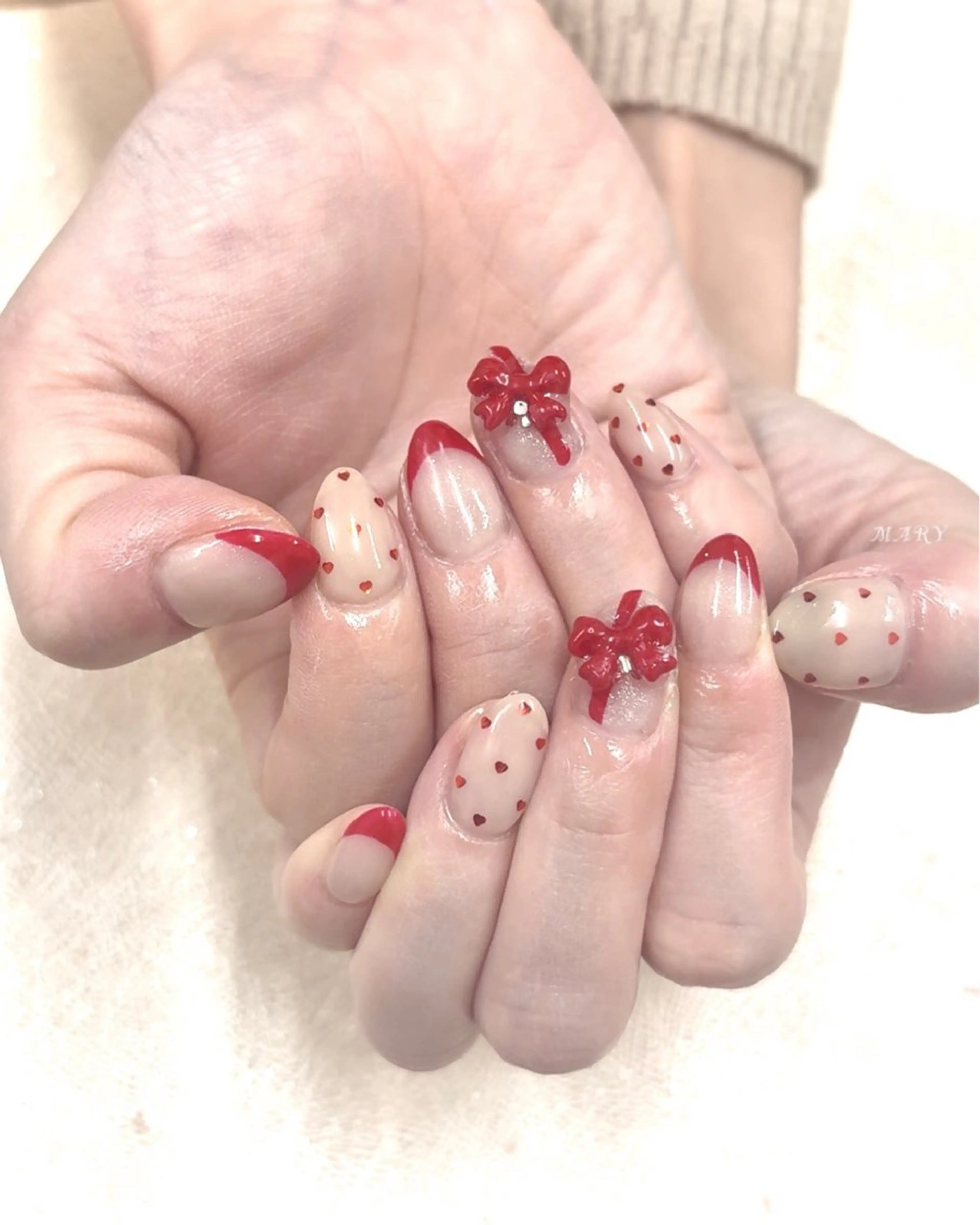 ネイル フレンチネイル ハート ニュアンスネイル 赤色 リボン ハンドネイル Mary nail所属・Mary nail .narumiのネイルデザイン
