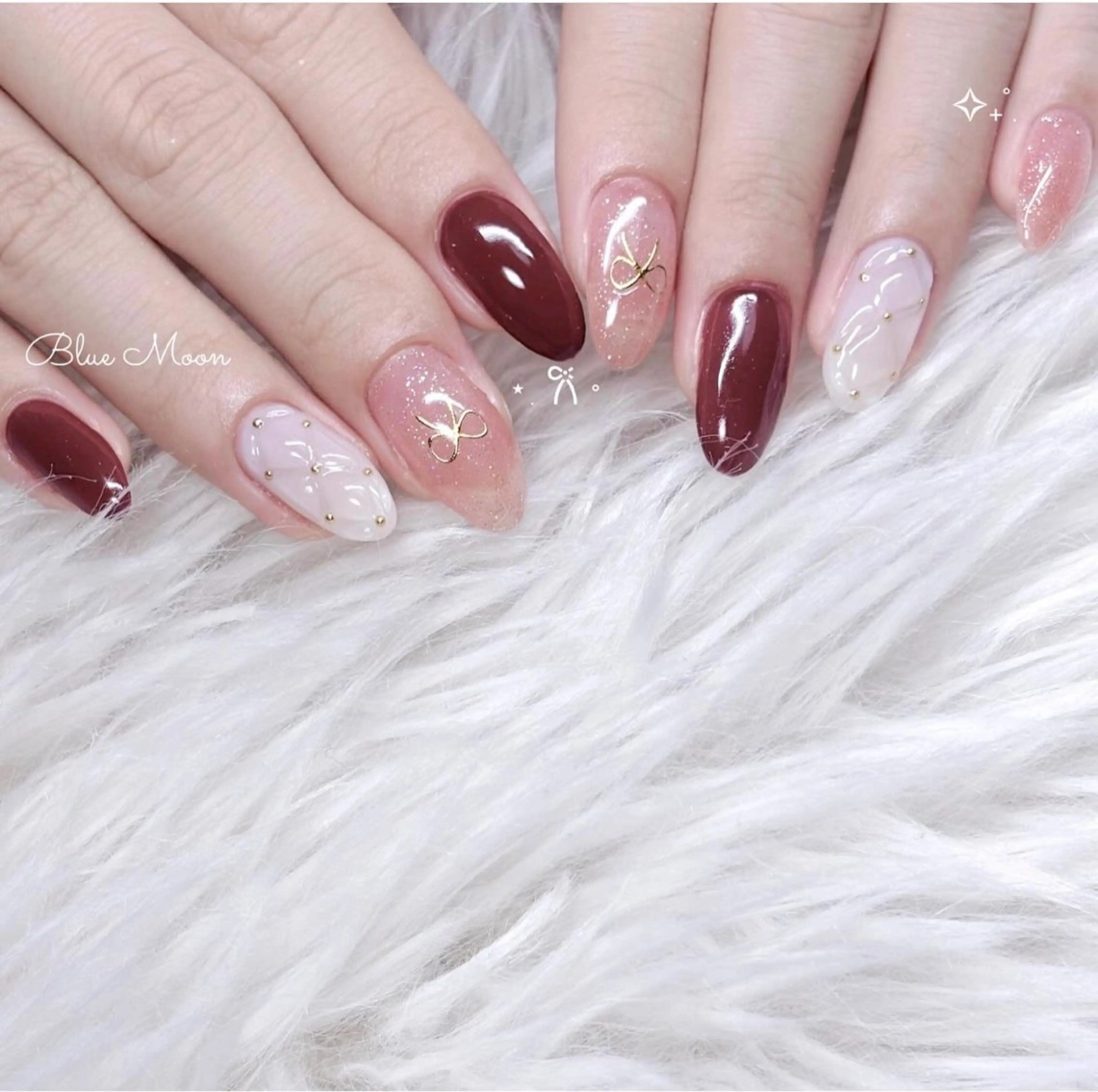 ネイル リボン ストーンネイル ハンドネイル フットネイル ハンドケア nail salon Blue Moonのネイルデザイン