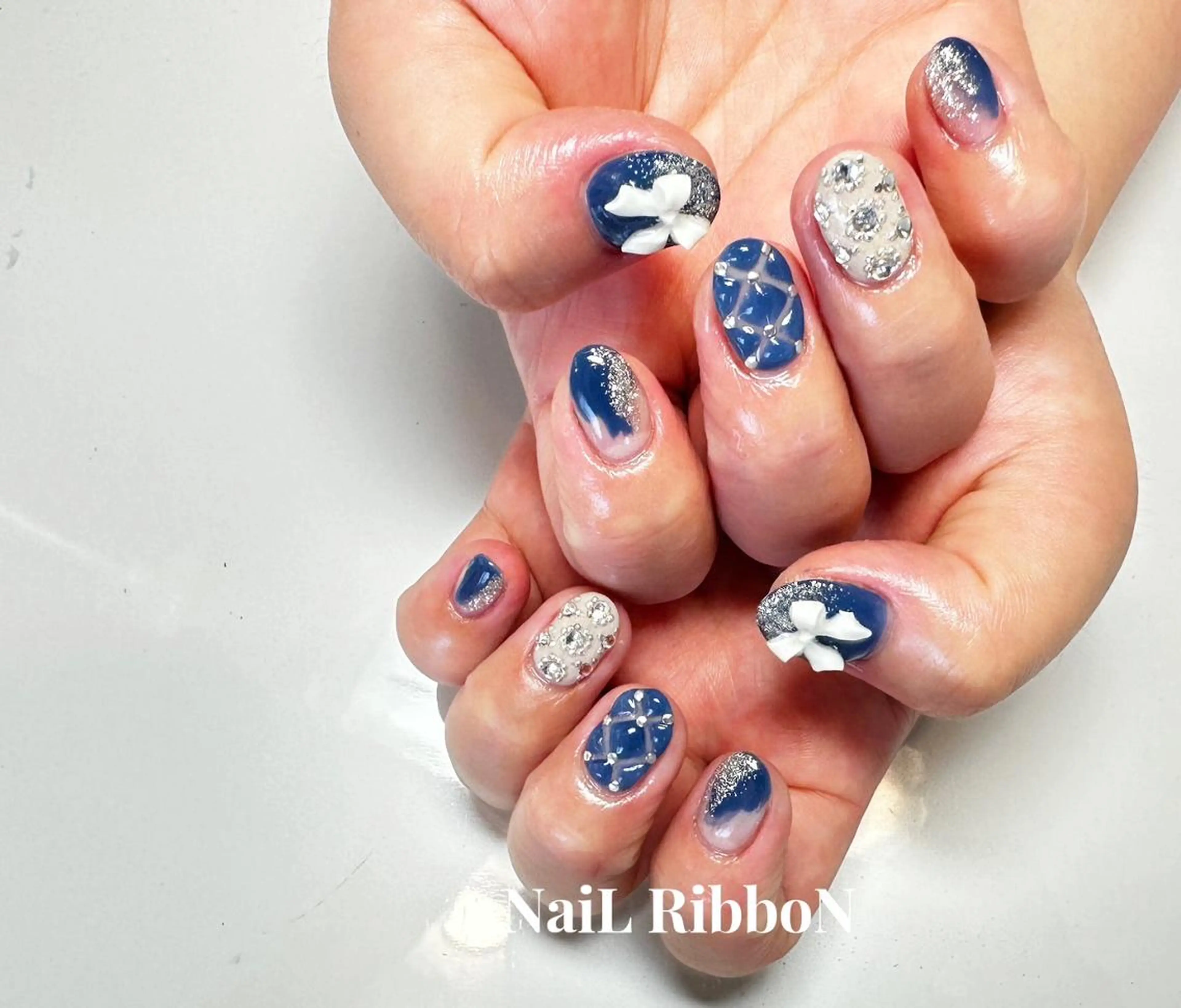 ネイル ネイルリボン 受付スタッフのネイルデザイン
