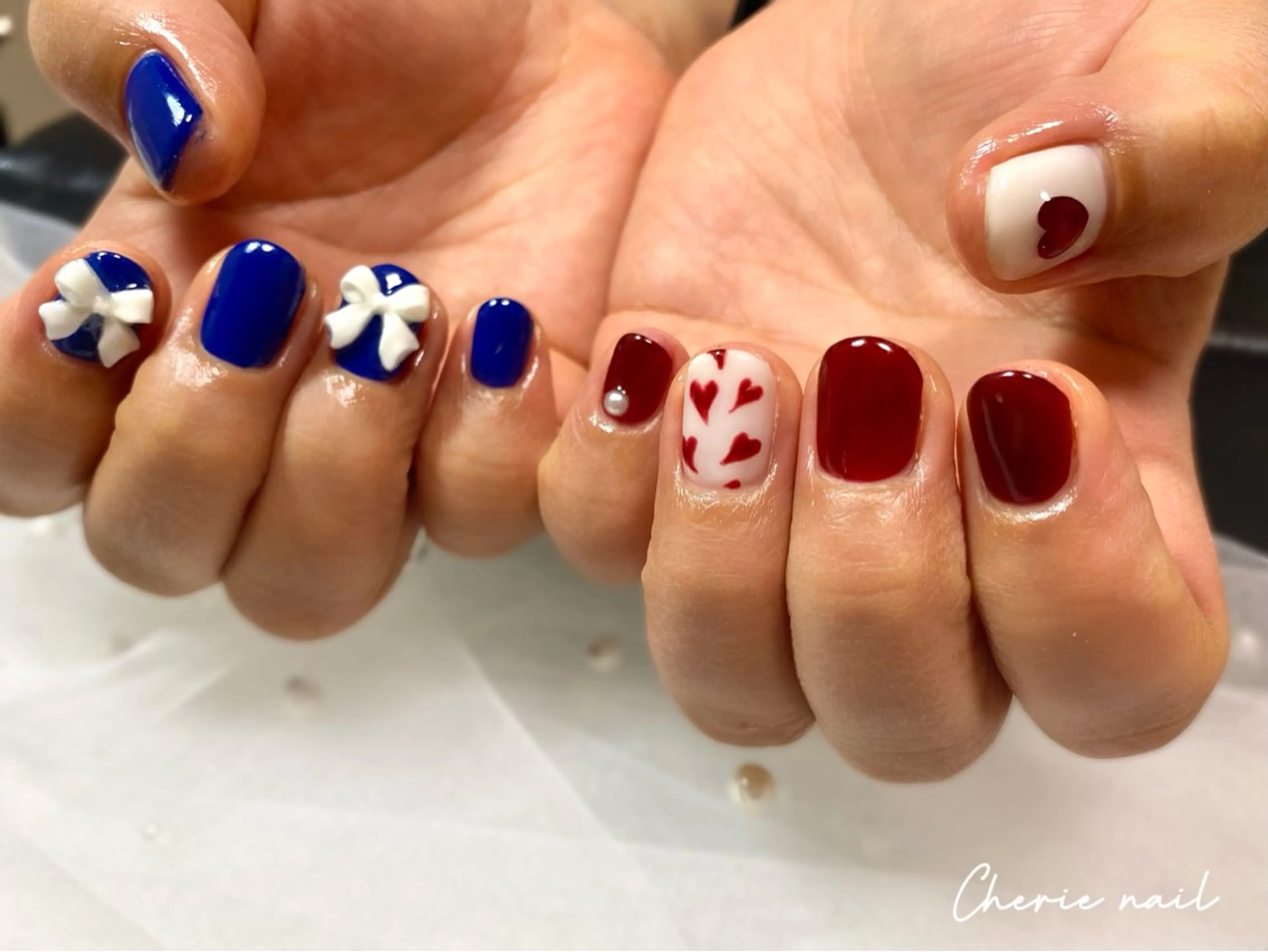 ネイル ボルドー ジェルネイル ハート ネイビー リボン ハンドネイル Cherienail yunaのネイルデザイン