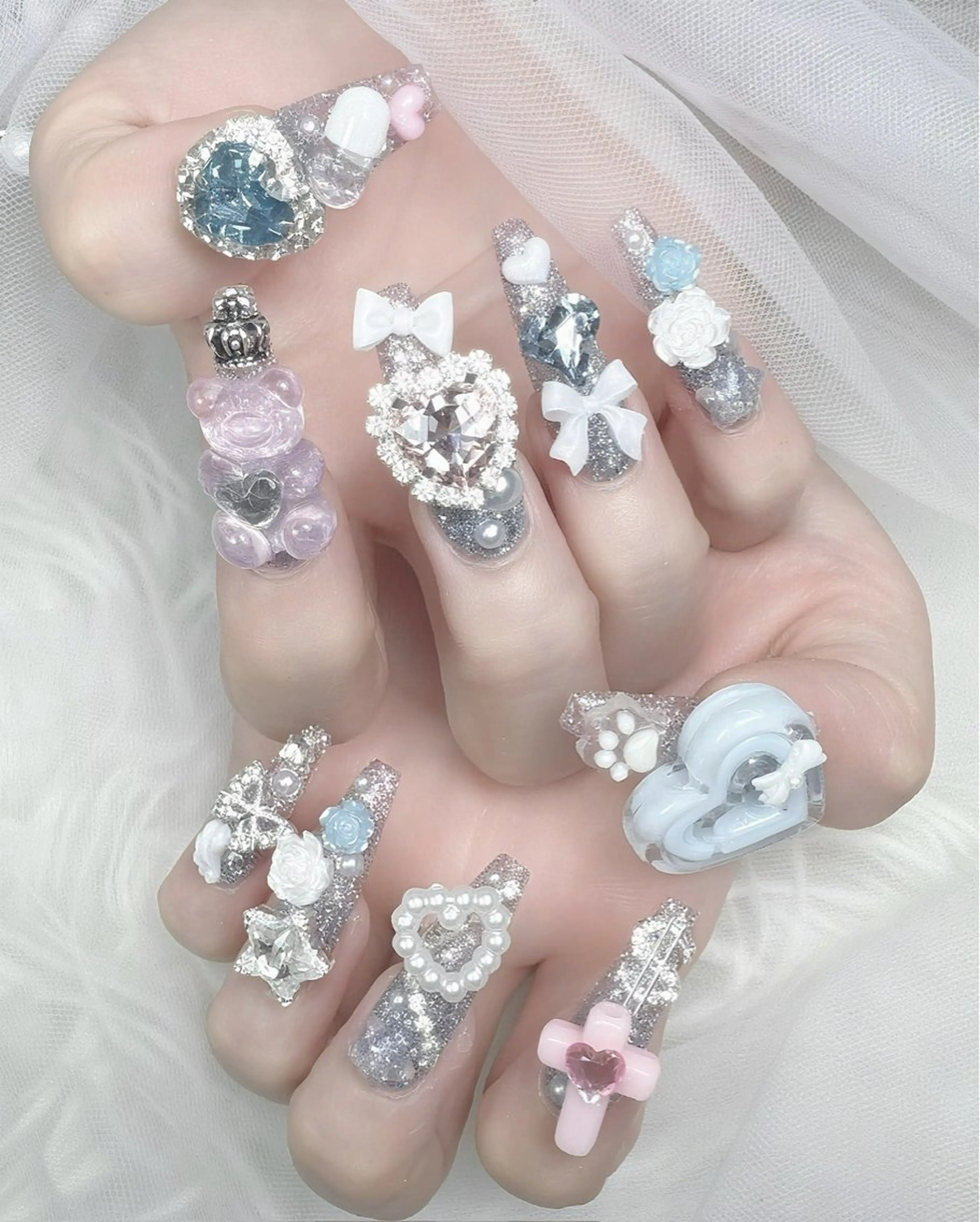 ネイル ハート キラキラネイル 水色 リボン 春ネイル ハンドネイル ハンドケア Gote Kawa nail salonのネイルデザイン