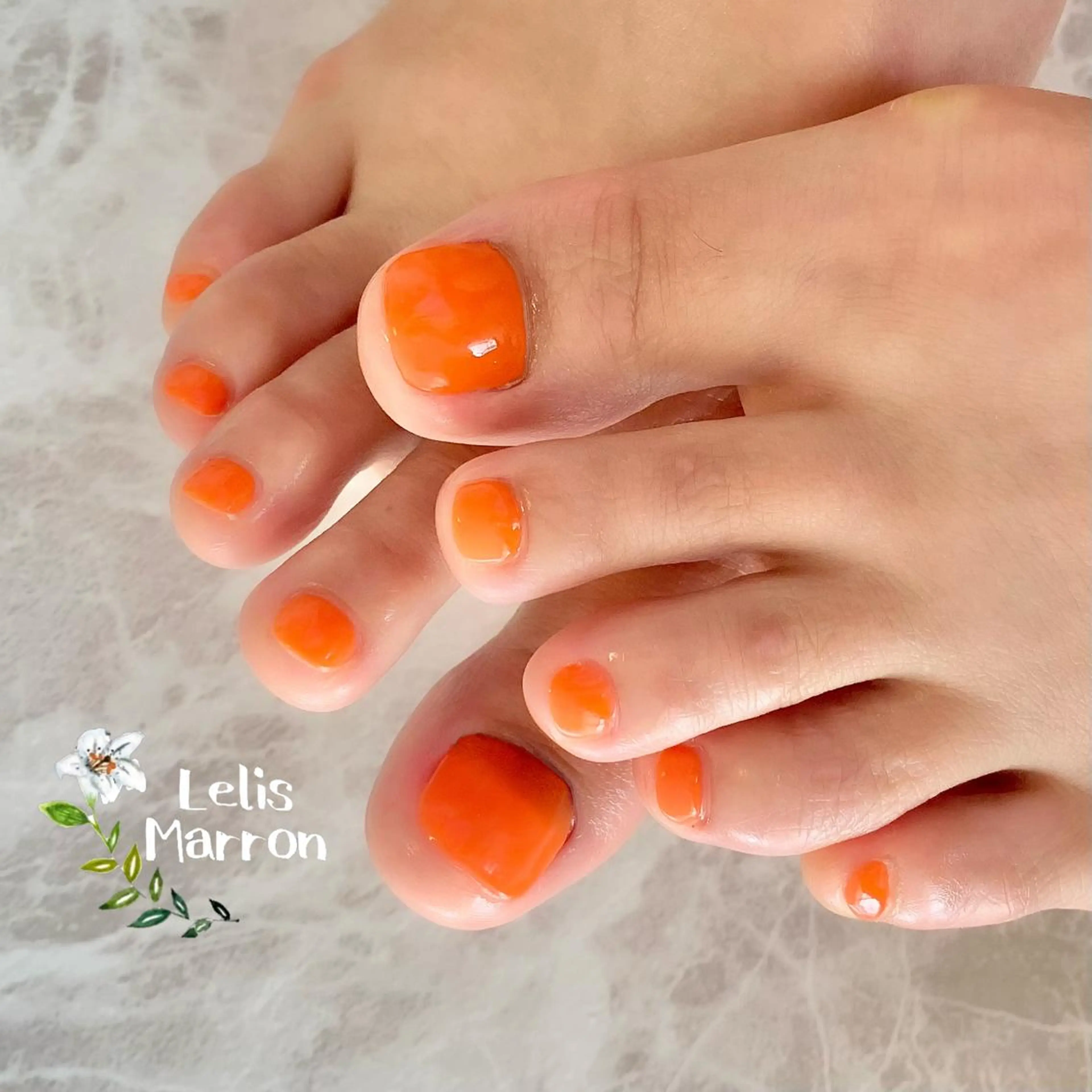 ネイル フットネイル ワンカラーネイル オレンジ Lelis Marron所属・岸 侑李のネイルデザイン