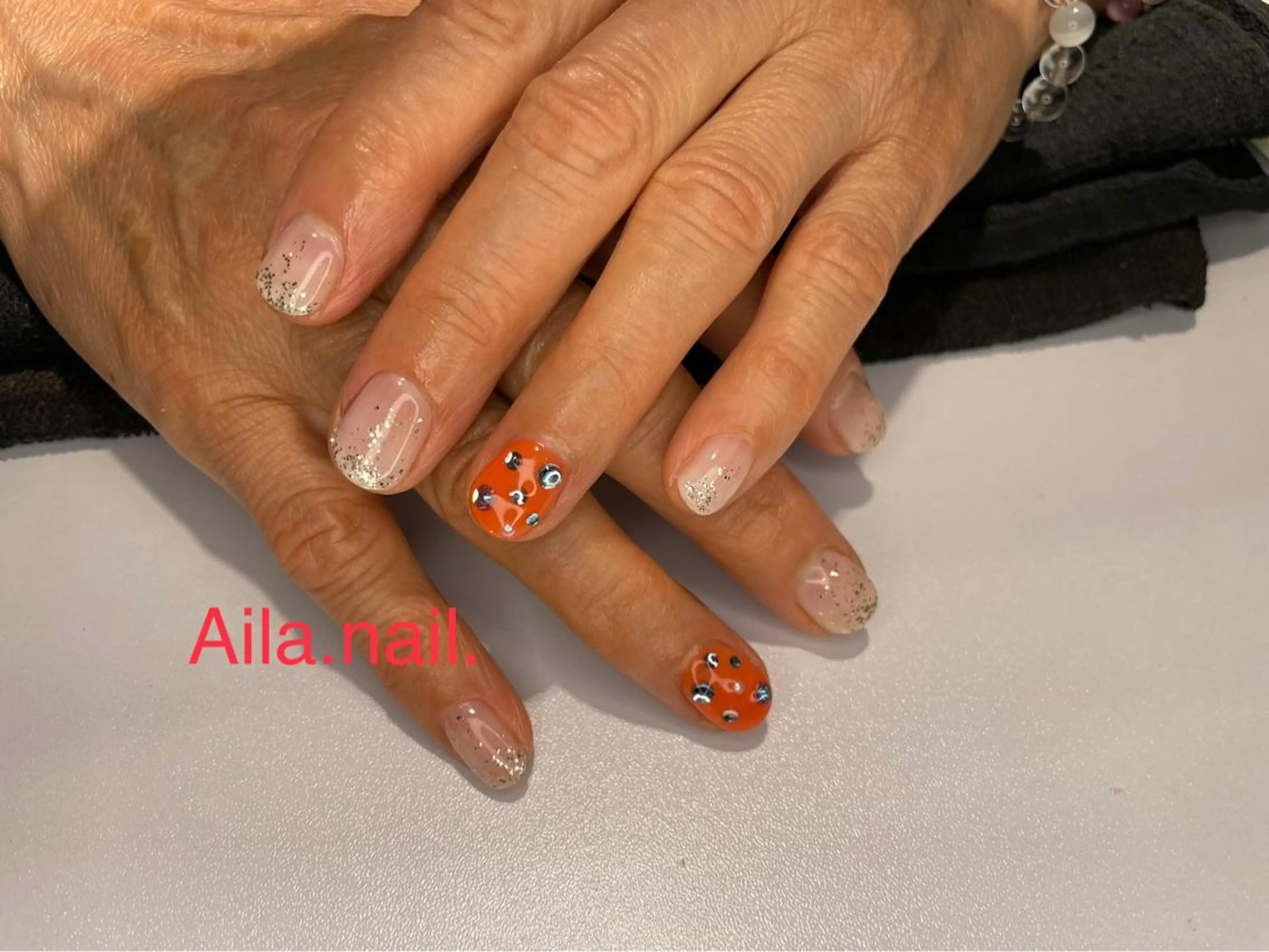 ネイル ラメ(グリッター) オレンジ ストーンネイル ハンドネイル フットネイル HAIR MAKE Aila所属・Aila.nail _F_AYUMIのネイルデザイン