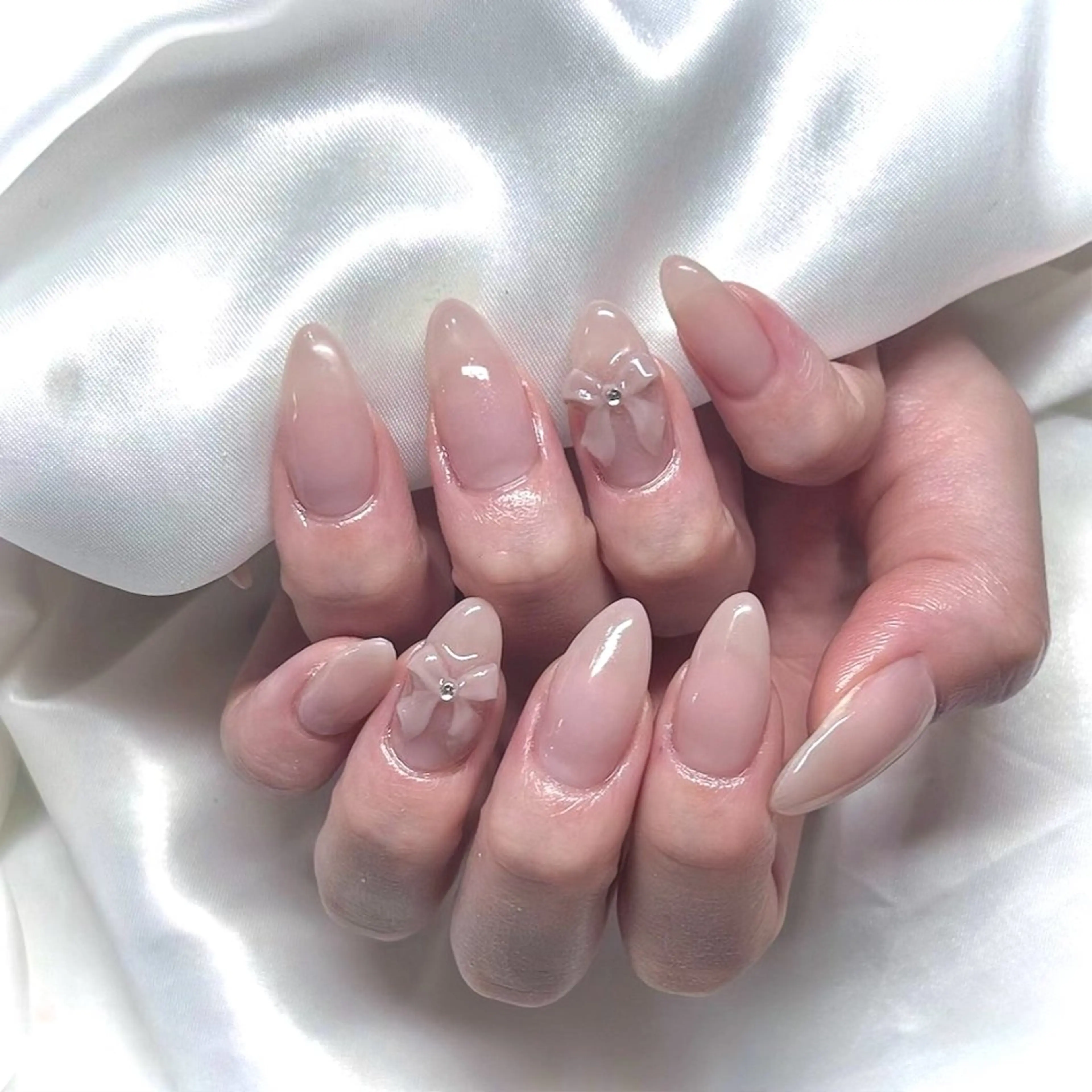 ネイル 韓国ネイル ワンカラーネイル リボン 春ネイル ワンホンネイル élu by Noriko 前原のネイルデザイン