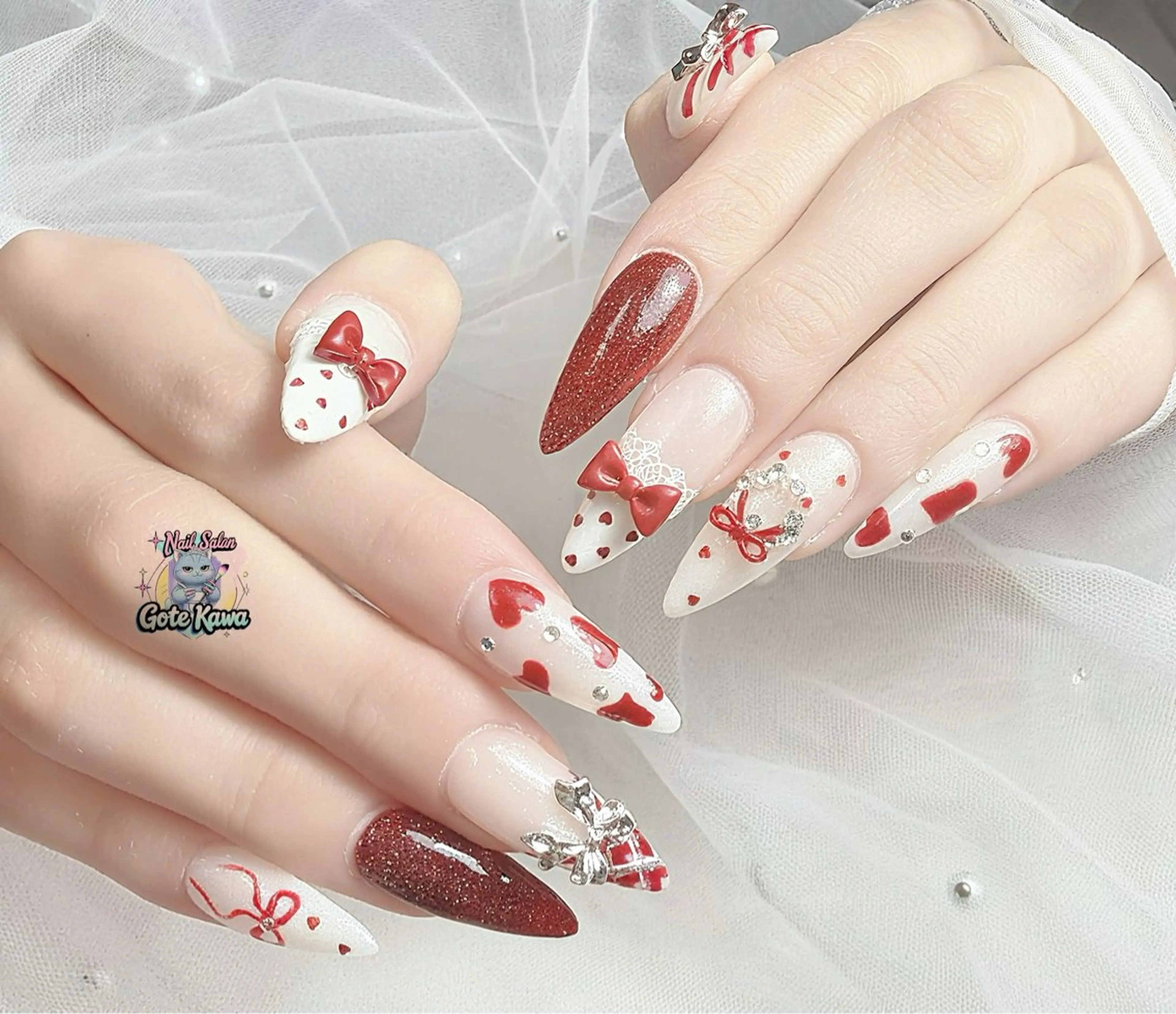 ネイル アートネイル ハート レース 赤色 リボン ハンドネイル GOTE KAWA Nail Salon(ゴテかわ)所属・Gote Kawa nail salonのネイルデザイン