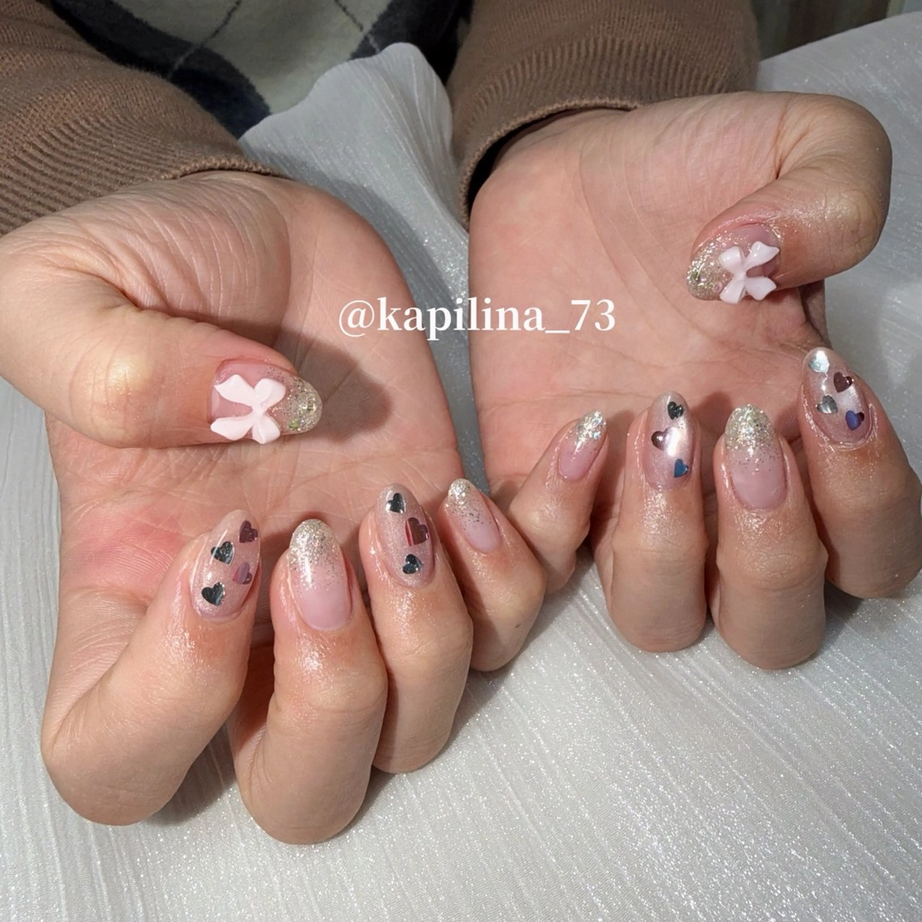 ネイル ハート ホログラムネイル マグネットネイル リボン ハンドネイル Nailsalon Ka pilina所属・Ka pilina MOMOのネイルデザイン