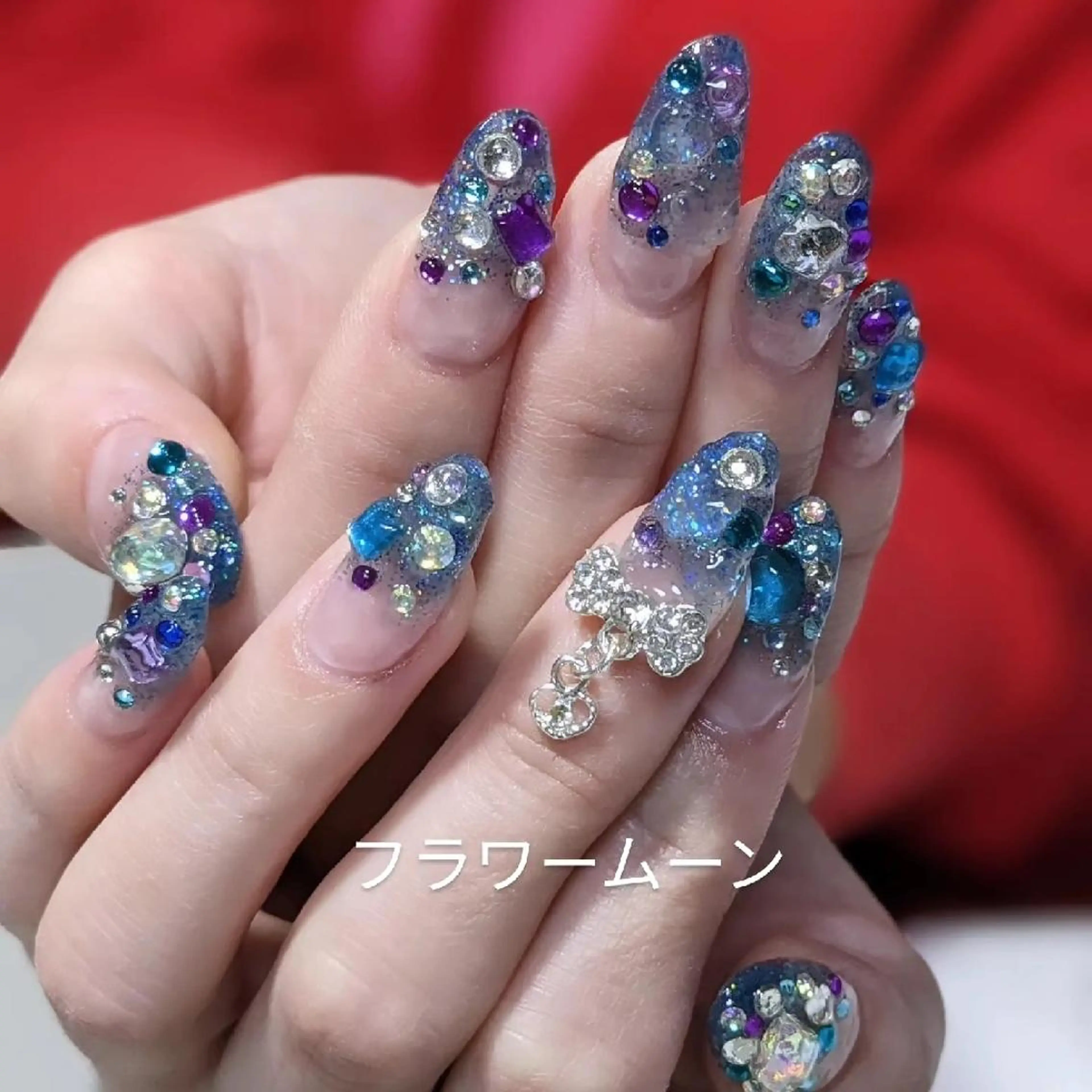 ネイル アートネイル グラデーション ラメ(グリッター) ストーンネイル フラワー ムーンのネイルデザイン