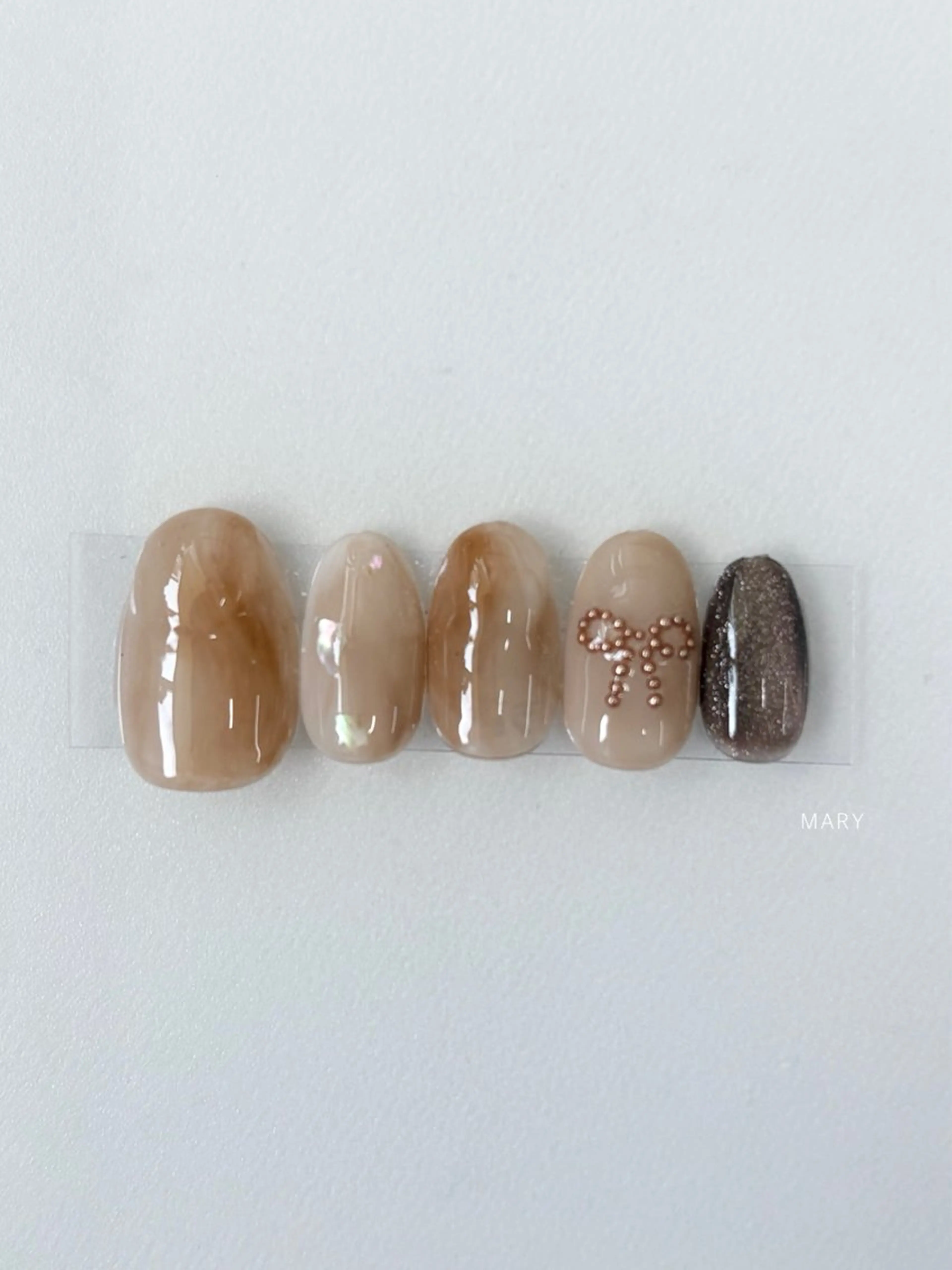 ネイル ブラウン ニュアンスネイル リボン ハンドネイル Mary nail所属・Mary nail .narumiのネイルデザイン