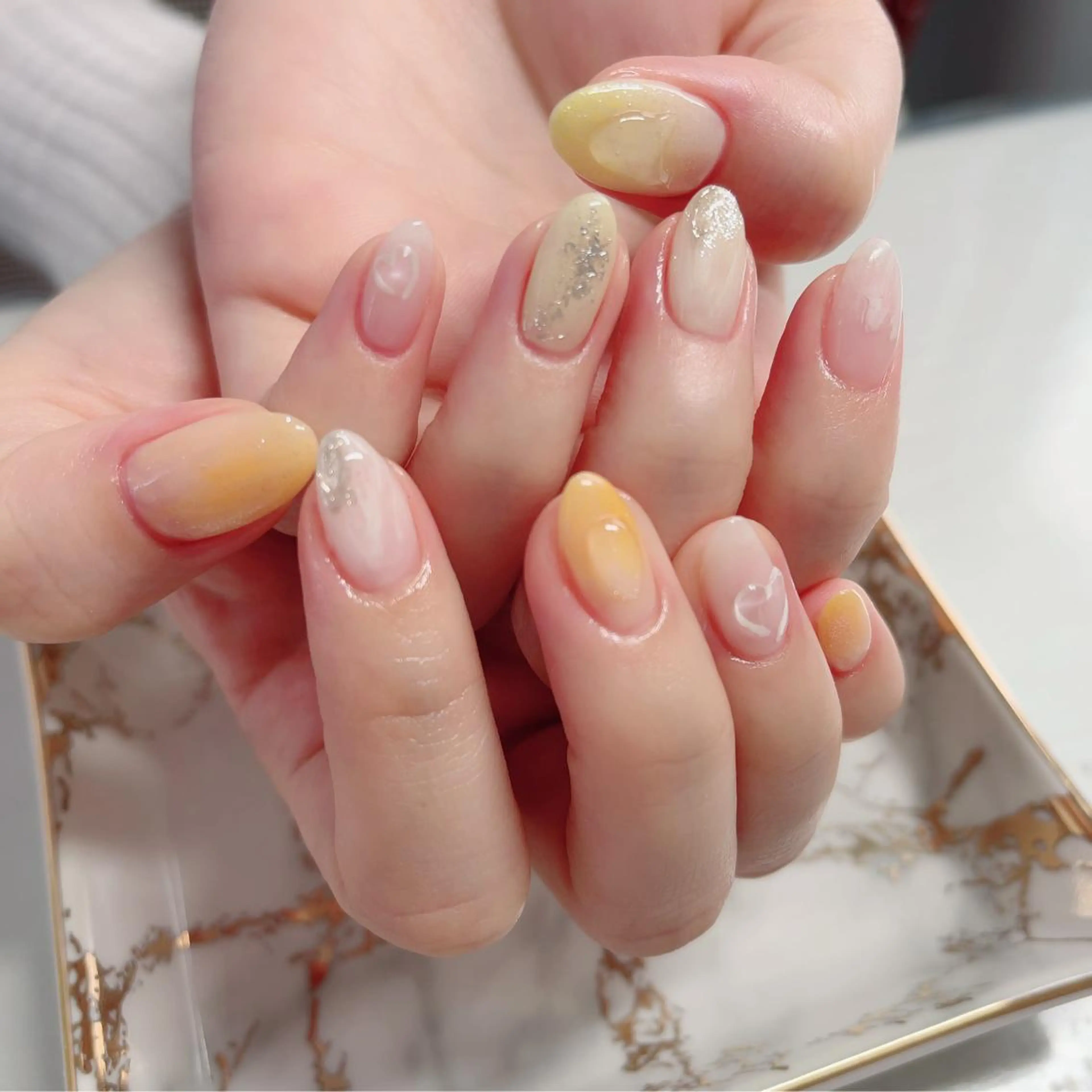 ネイル ジェルネイル ニュアンスネイル オレンジ 春ネイル 黄色 ハンドネイル Baby Nailのネイルデザイン