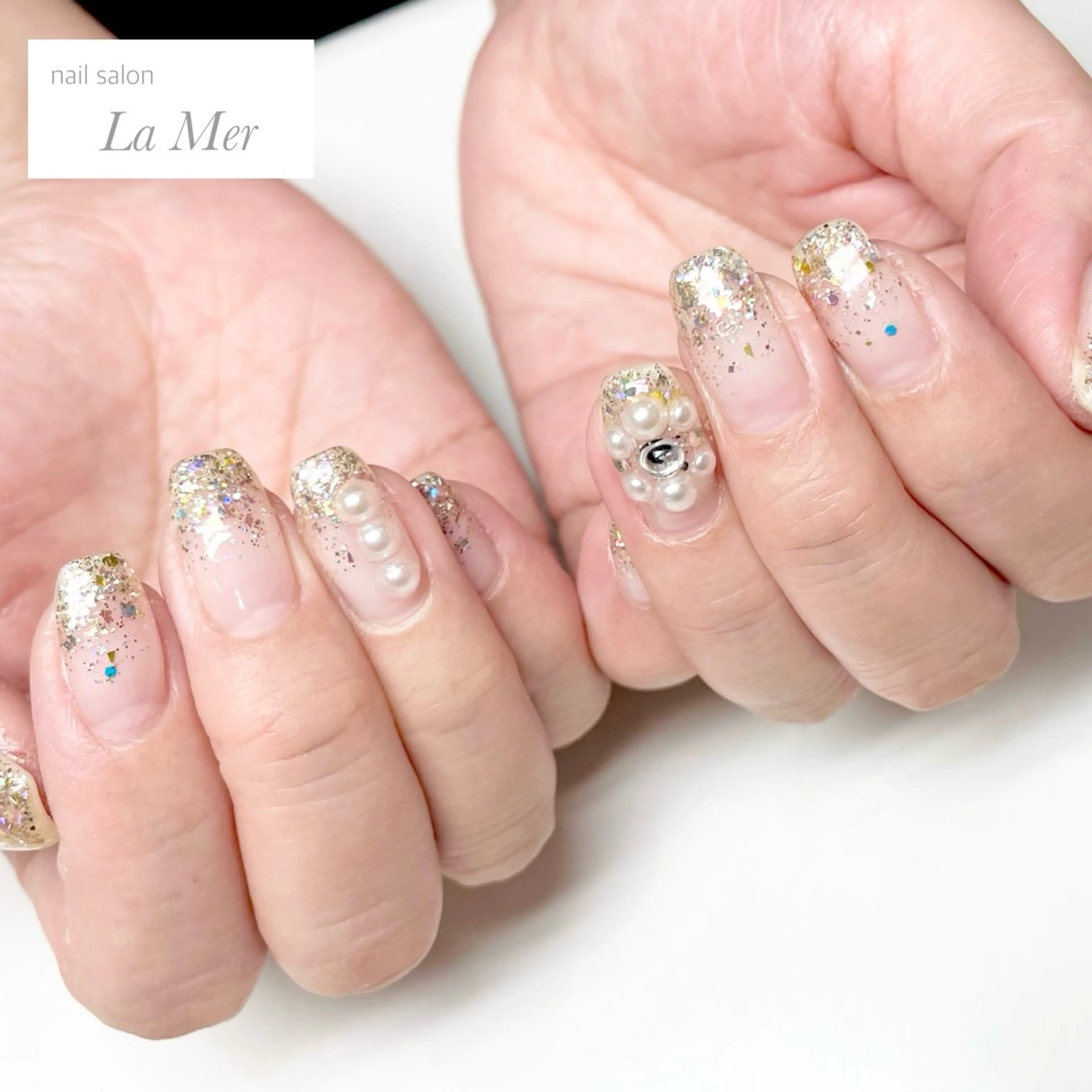 ネイル フラワーネイル グラデーション キラキラネイル ラメ(グリッター) ラメグラデーション nailsalon La Merのネイルデザイン
