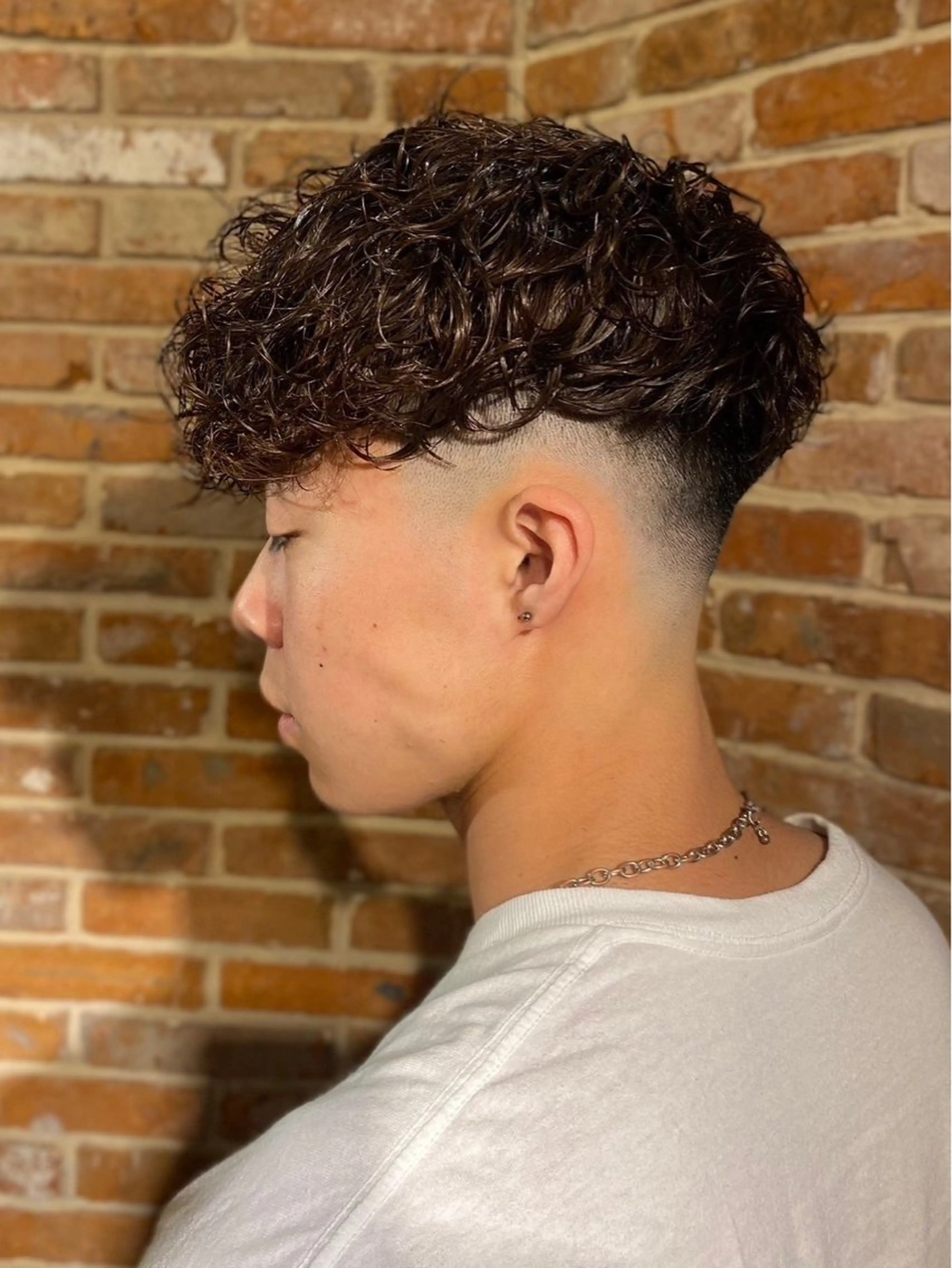 ミディアム パーマ メンズ フェードカット blazeman barbershop 新宿店所属・猪井 明のヘアスタイル