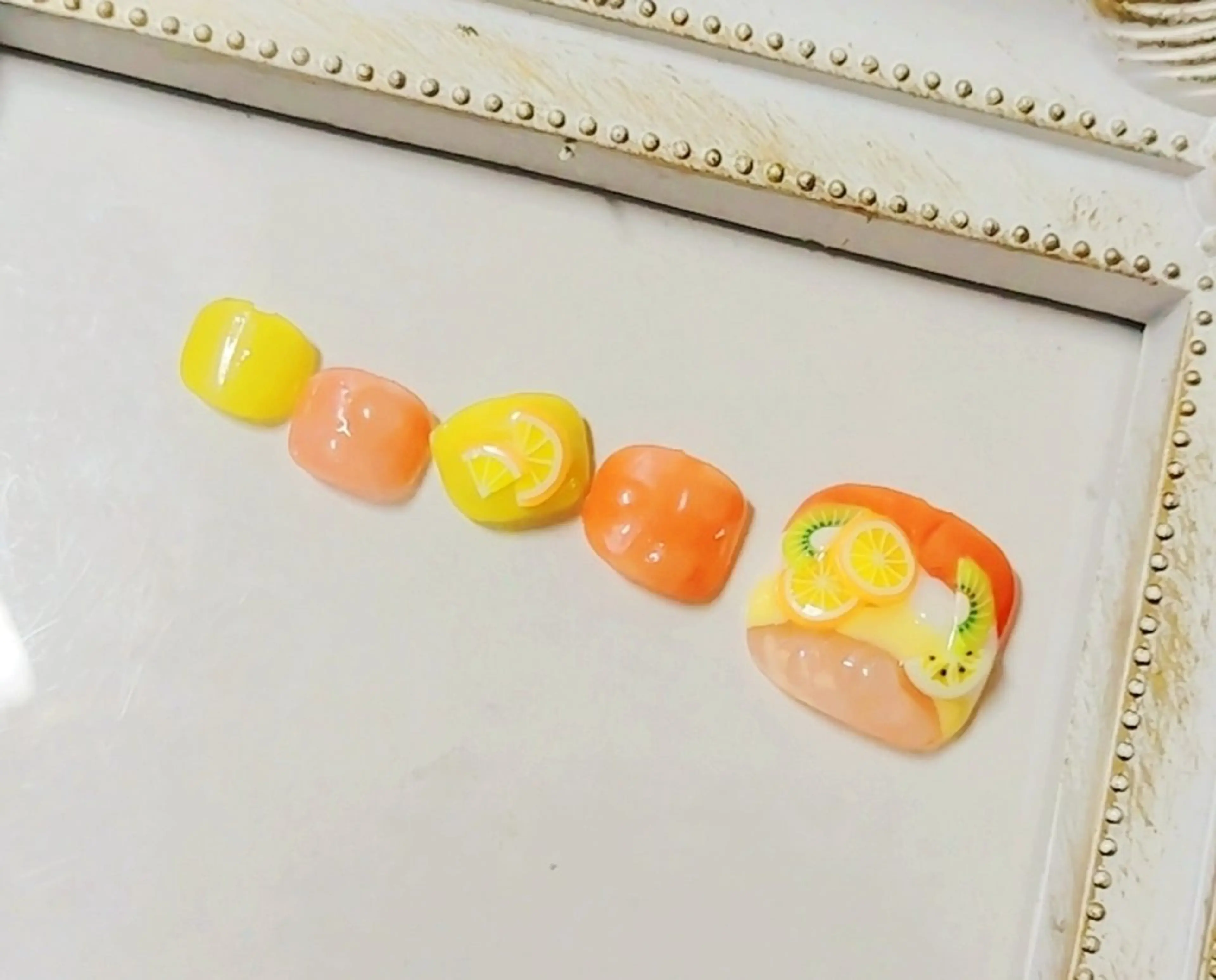 ネイル オレンジ フットネイル Jewel SecretBaseのネイルデザイン