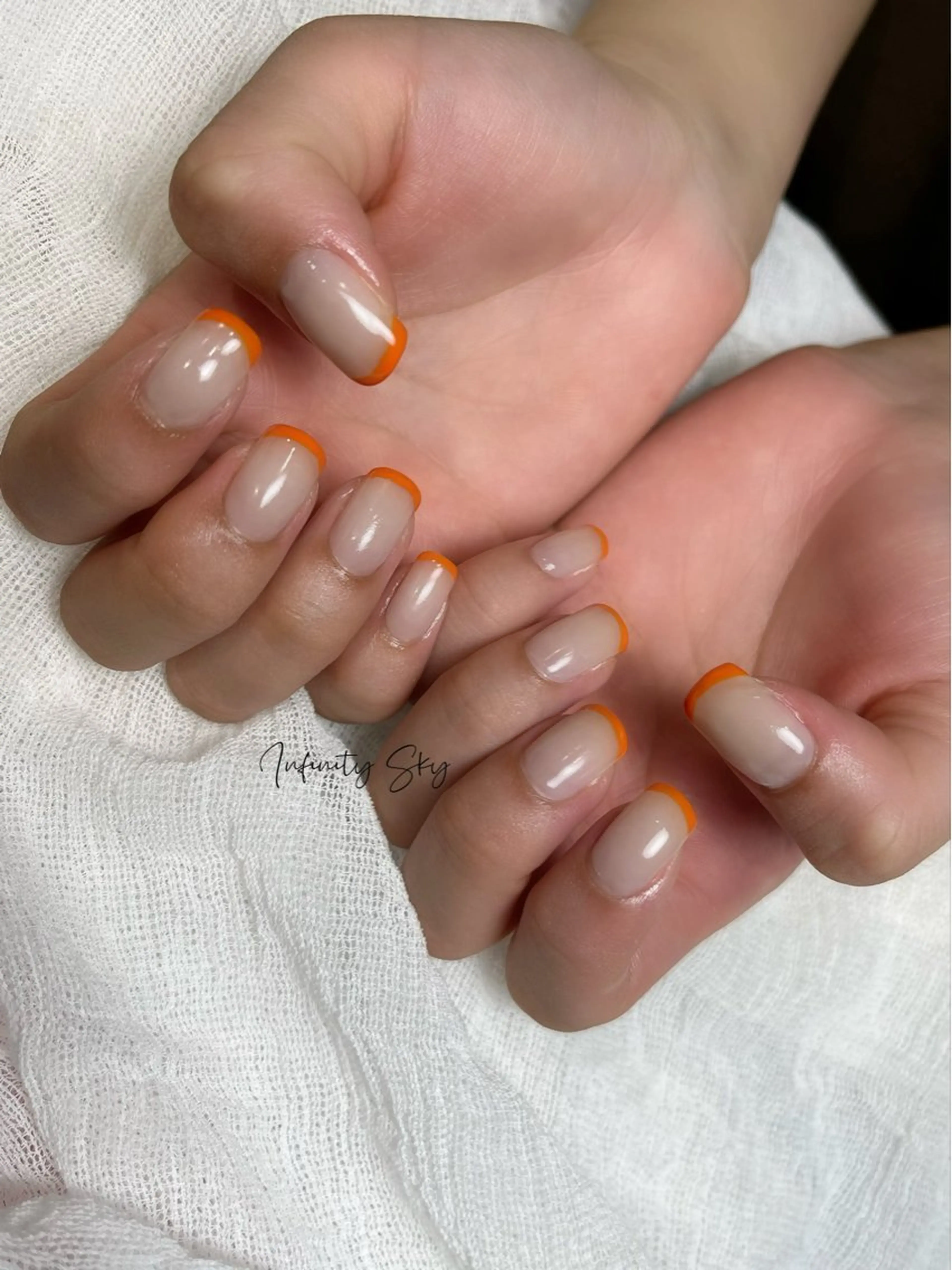 ネイル フレンチネイル オレンジ ハンドネイル infinity skyのネイルデザイン