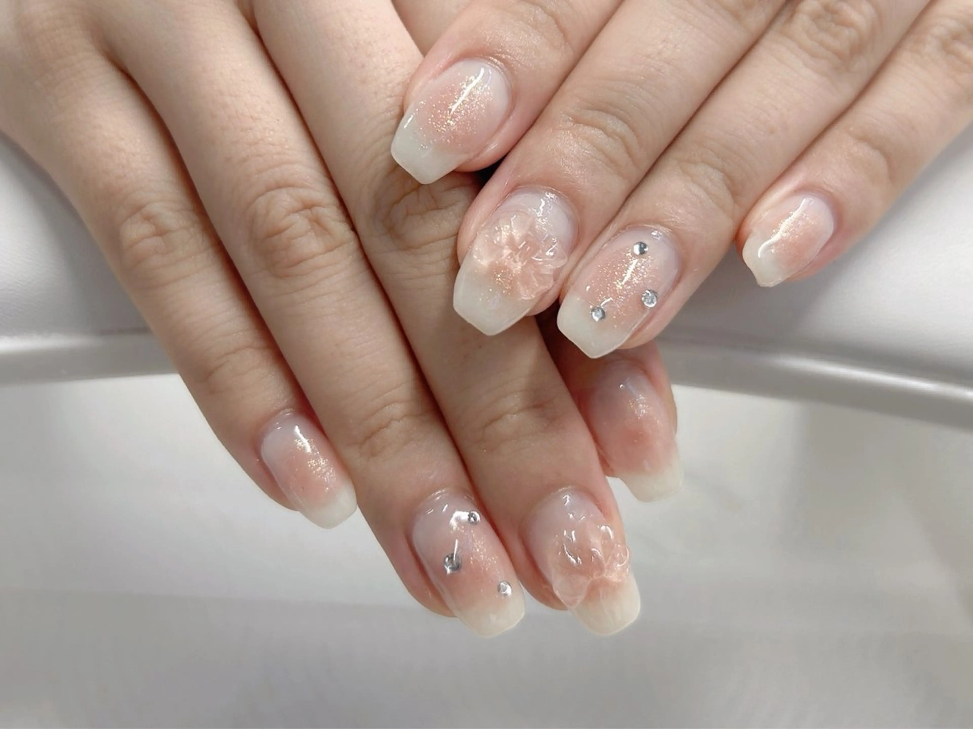 ネイル チークネイル 桜ネイル ガーリー リボン ワンホンネイル ハンドネイル Forca total studio所属・Forca Airaのネイルデザイン